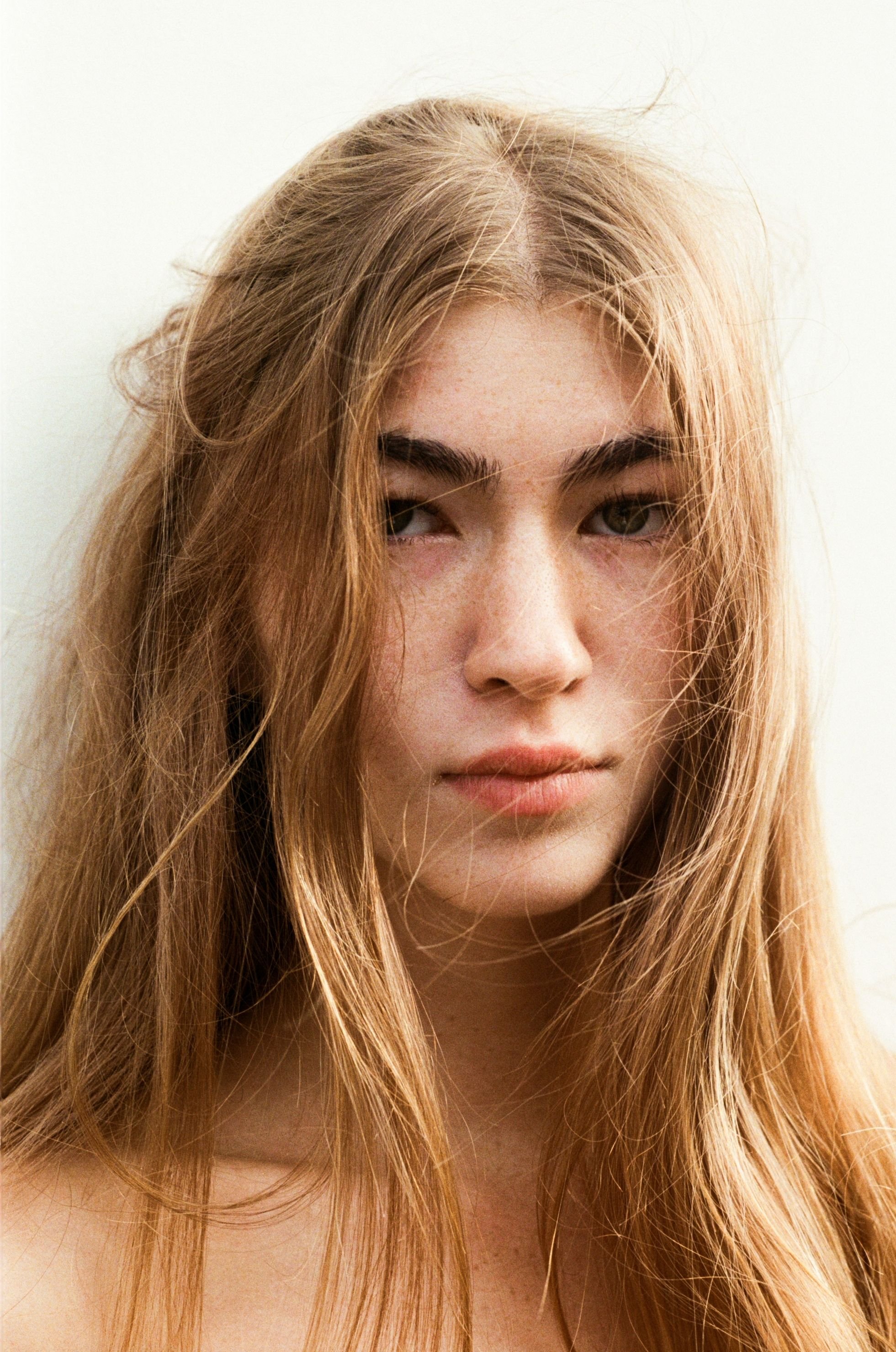 High-fashion editorial imagery captured on analogue film with a focus on form, movement and texture.