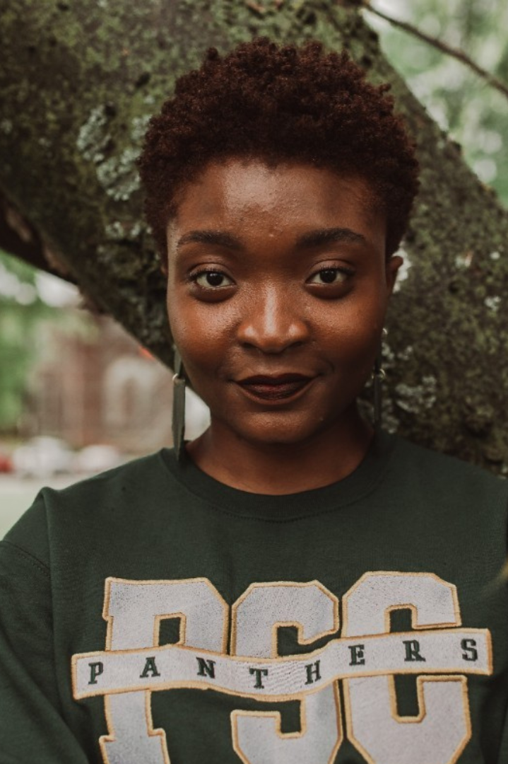 Last Mile awardee Christabel A. in a PSC Panthers shirt