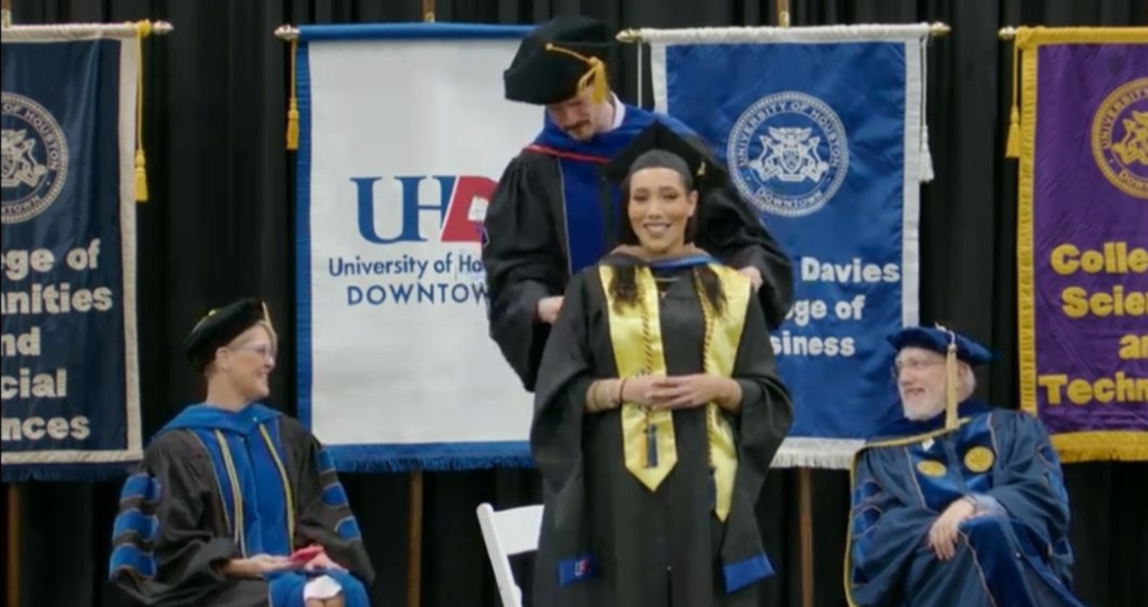 Milestone unlocked! Devonie Nelson celebrates earning her Master’s Degree at the University of Houston-Downtown graduation ceremony.