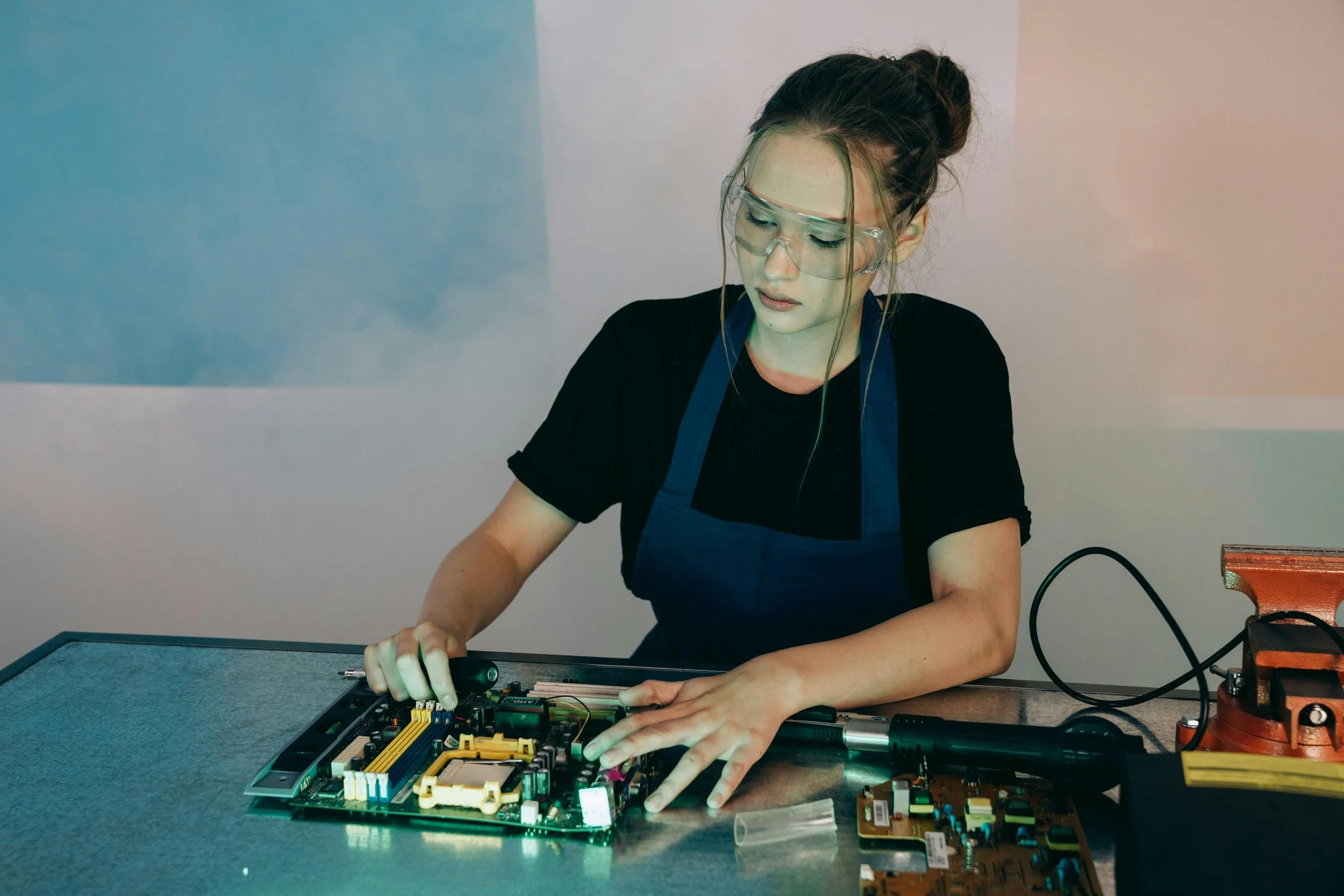 Student working on an electronics project in a lab