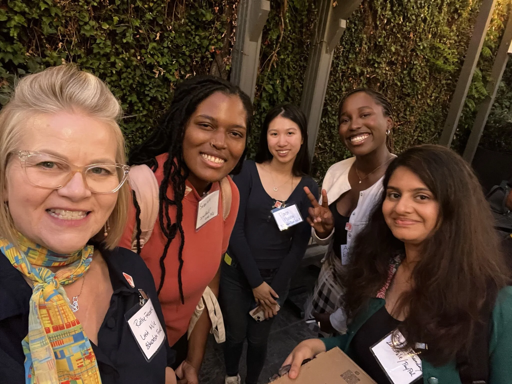 Group of women taking a selfie at an evening event