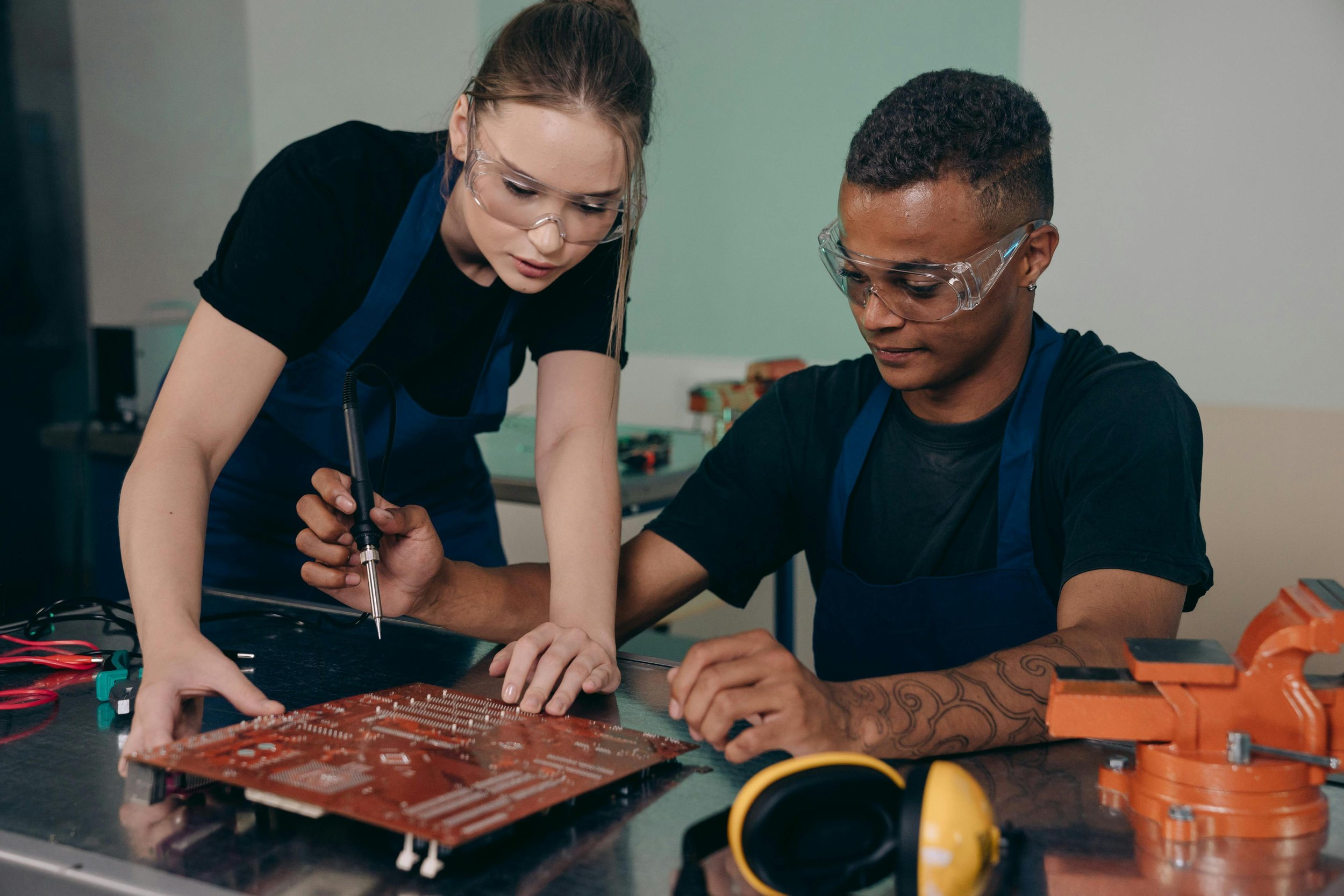 Students working together at an electronics workbench