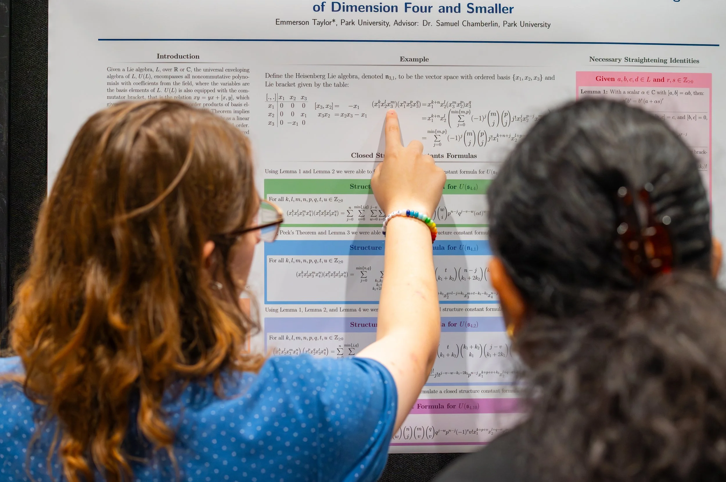 Students discussing a research poster