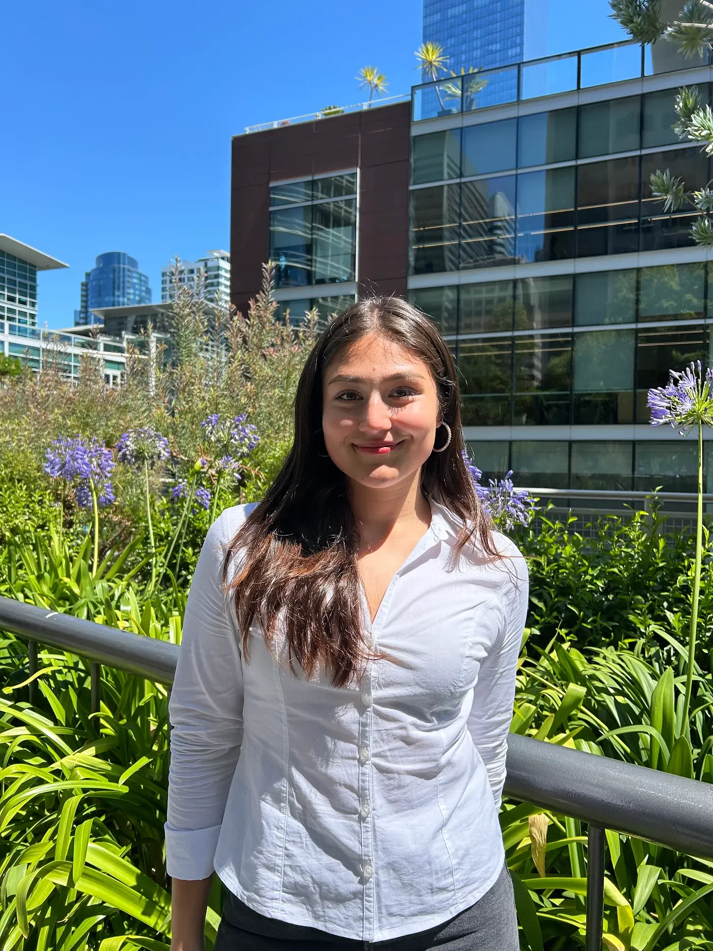 Smiling outdoors on a campus