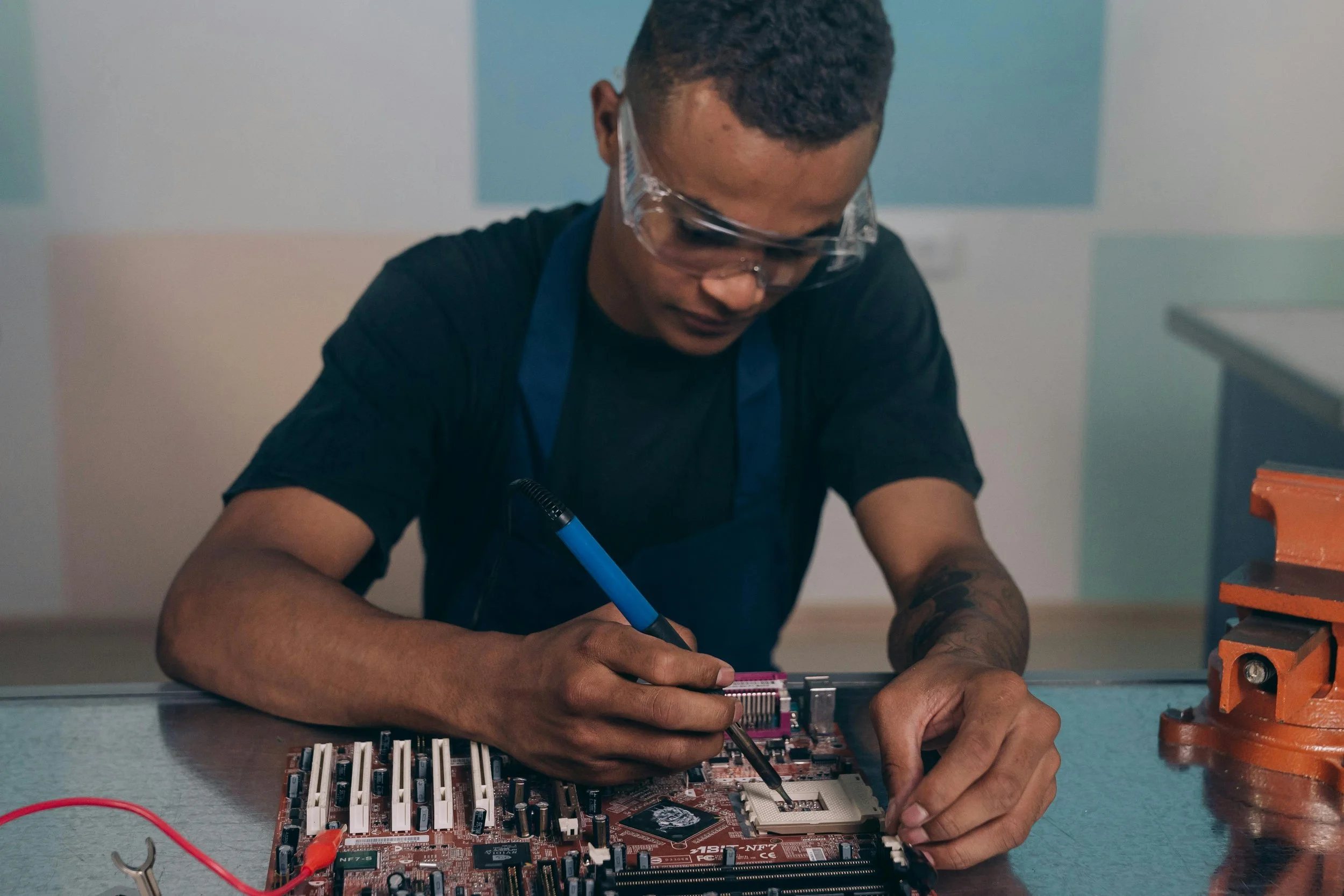 Student soldering a circuit board