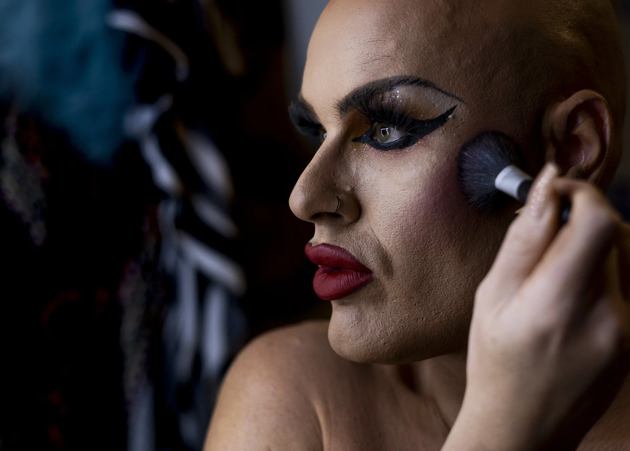 Whitney Naomi VanderVixen applies her makeup in her drag studio before performing at Five15 drag bar in Royal Oak, Mich., on Oct. 23, 2023. Every Halloween weekend, Five15 hosts a shadow cast performance of the Rocky Horror Picture Show featuring the