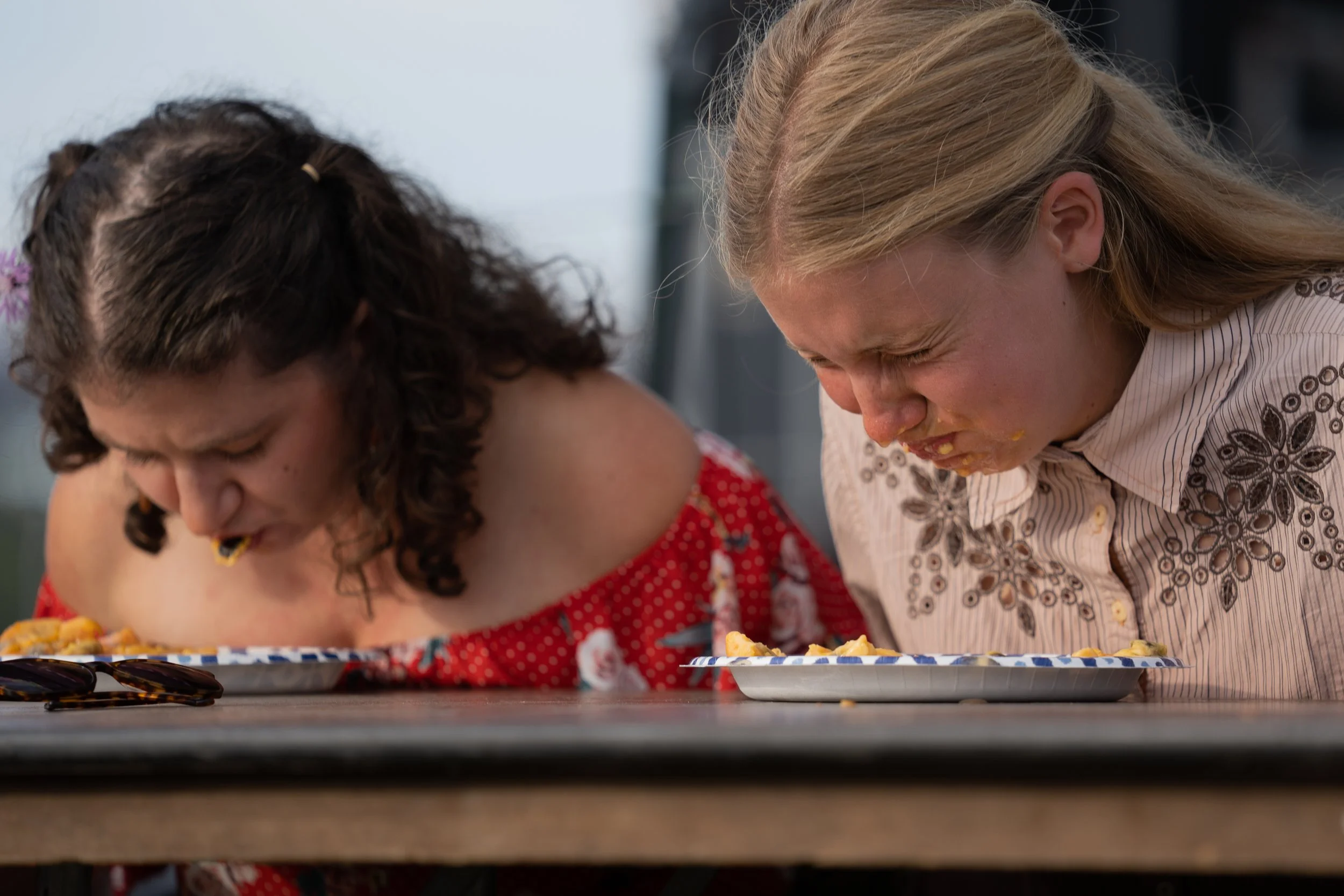 Participants race to eat pawpaw pulp during the pawpaw eating contest at the Pawpaw Festival at Lake Snowden in Albany, Ohio, Sept. 15, 2023. | Megan VanVlack
