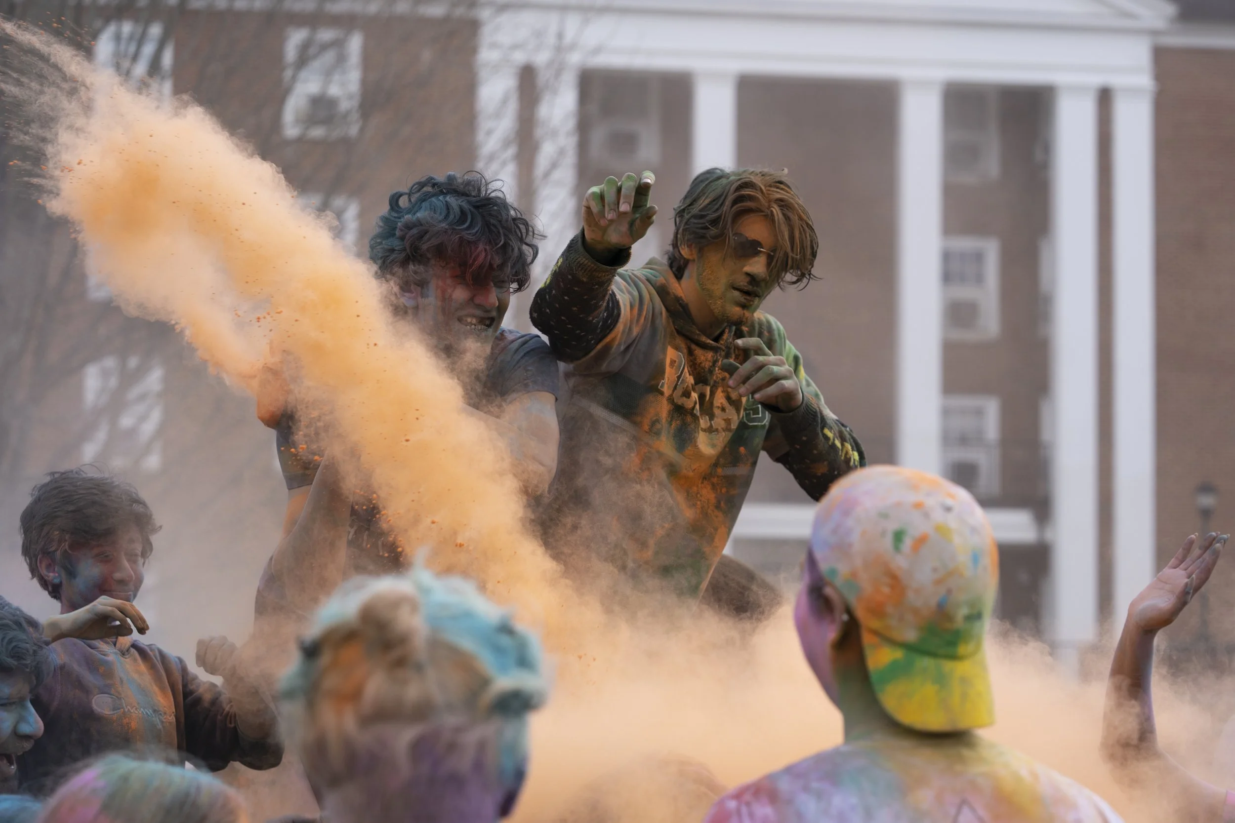 Members of the Athens community celebrate Holi together on Ohio University's
South Green with colorful powder on March 4, 2023. | Megan VanVlack