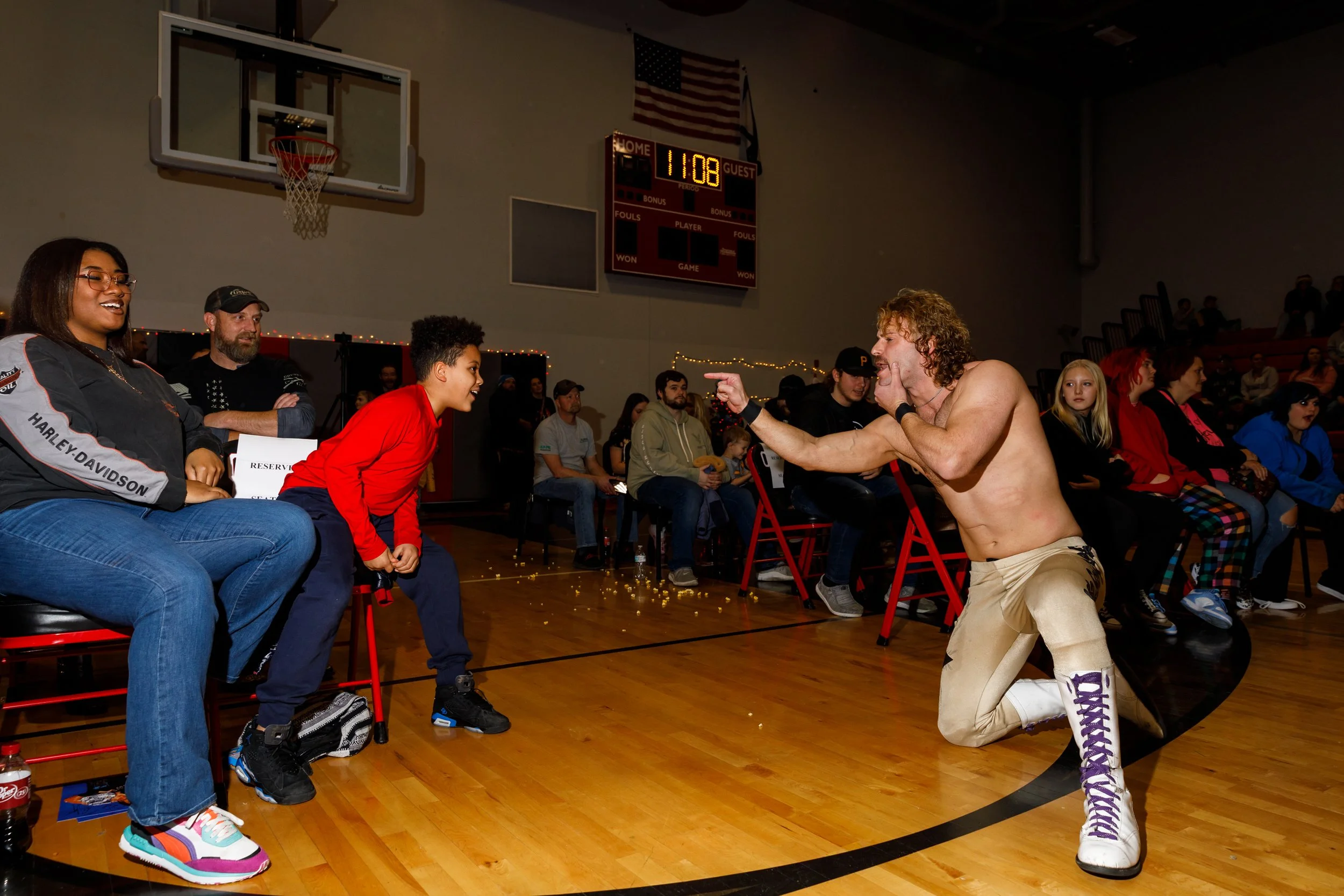 A fan engages in a playful altercation with wrestler Jason Hendrix during a show in Oak Hill, W. Va. In pro wrestling, a heel is the villain, or rule-breaker. The heel will often heckle fans during a match to keep energy up. Audience
members engage b
