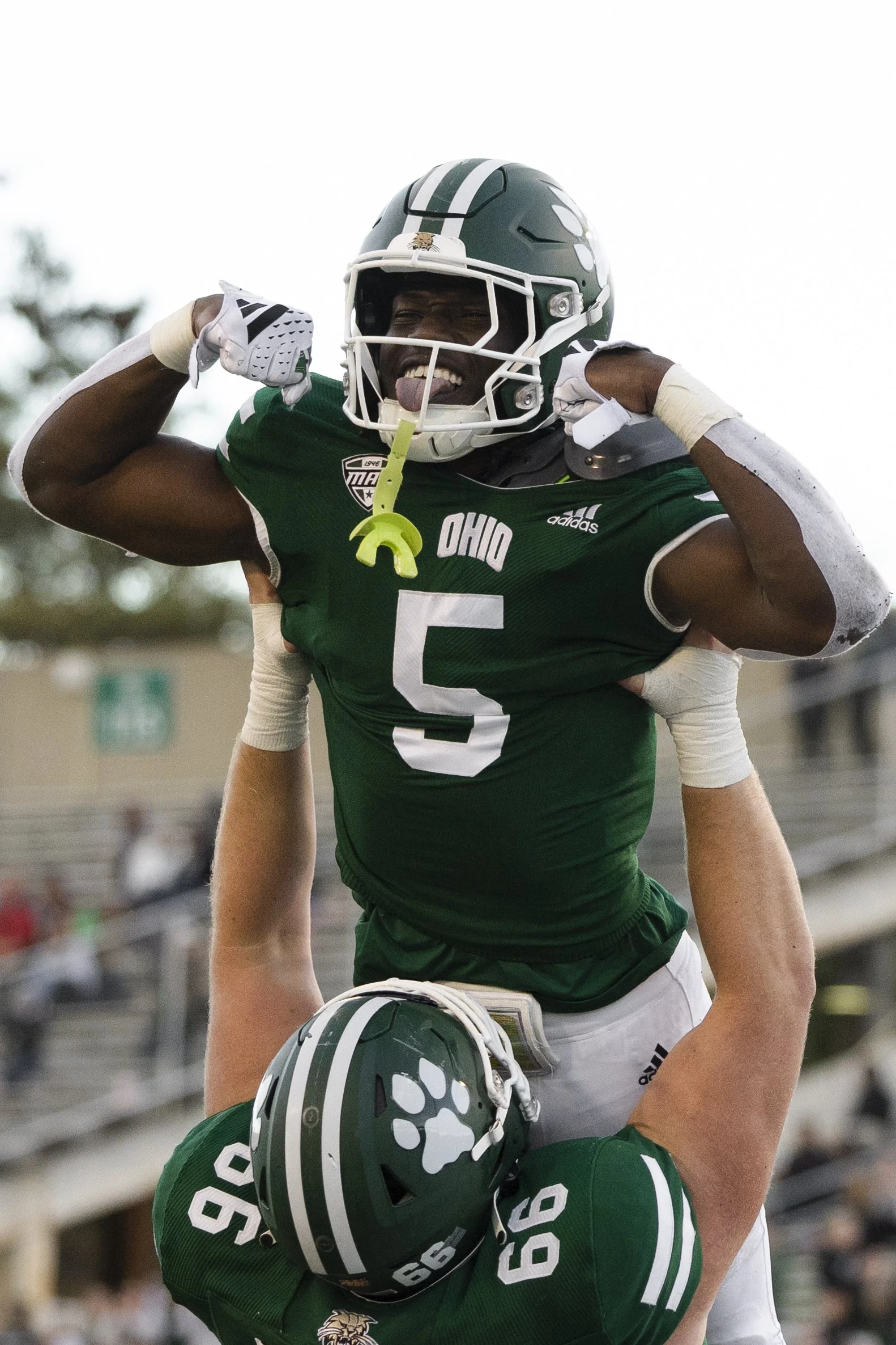 Ohio running back, Sieh Bangura, 5, is lifted into the air after his touchdown against Kent State at Peden Stadium in Athens, Ohio, Oct. 7, 2023. | Jack Tatham