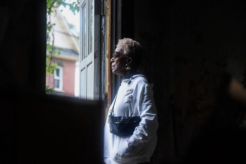 Trevellya Ford Ahmed stares out the door from inside the Mount Zion Baptist Church. | Patricia Porter