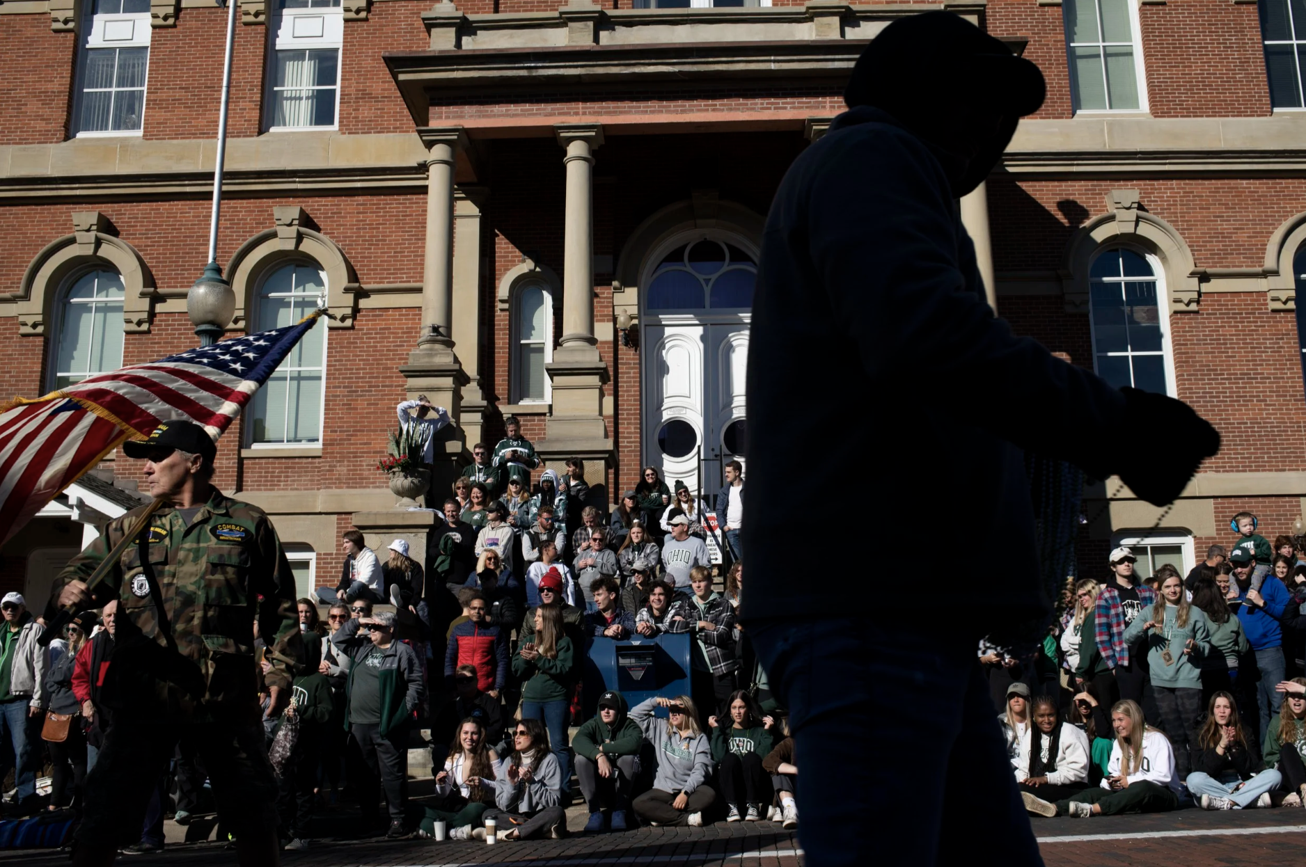 Crowd members gather in front of the Athens Court House to watch the Ohio University Homecoming parade in Athens, Ohio, Saturday, Oct. 8th, 2022. | Dylan Benedict