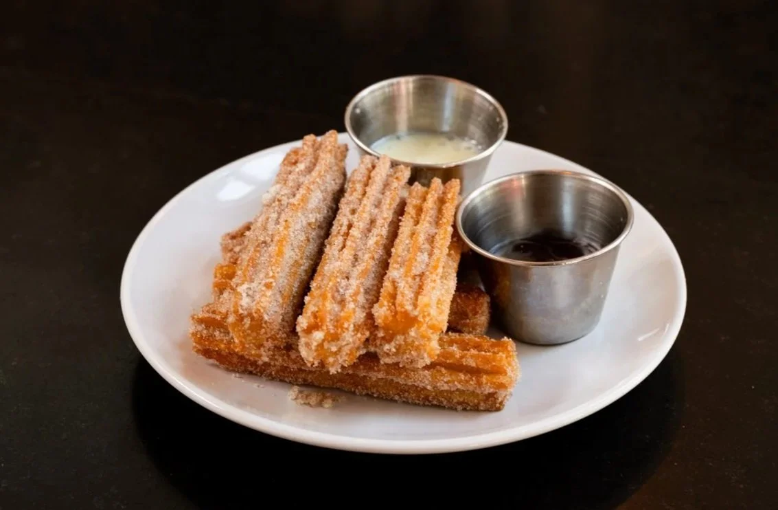 Churros with a side of chocolate  at Papito Hayes