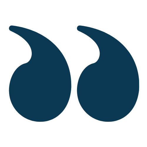 Two dark blue quotation marks on a white background.