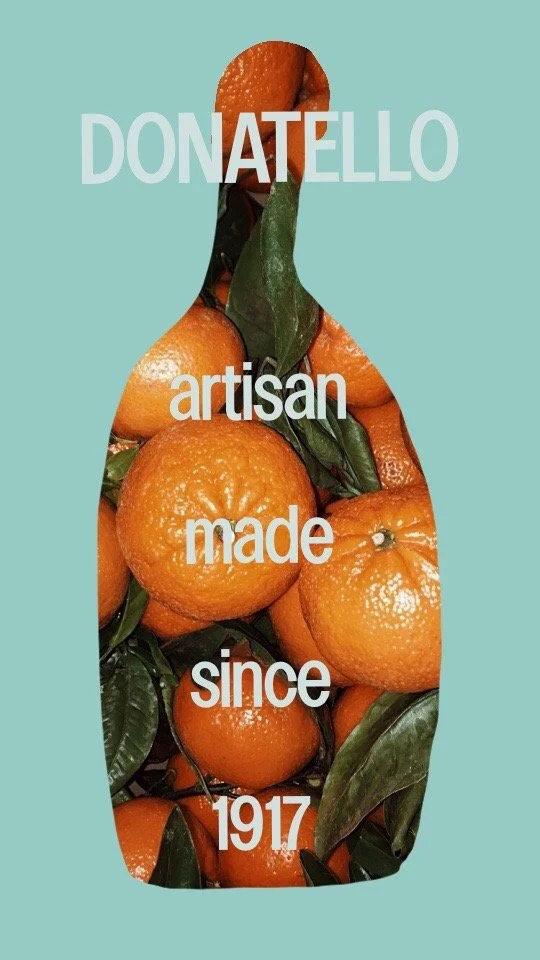 A graphic design featuring a silhouette of an orange with green leaves, filled with oranges and leaves. Overlaid text reads: "Donatello artisan made since 1917."