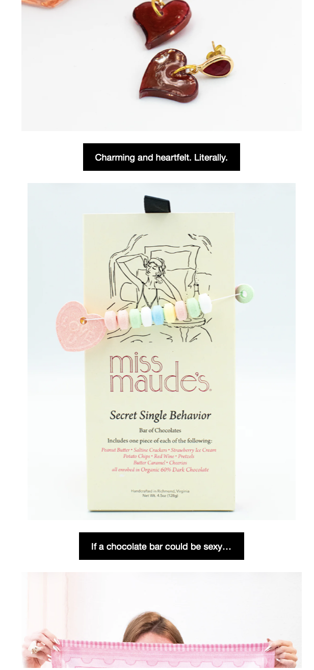 Top: Heart-shaped red and brown jewelry pieces with gold accents. Middle: A greeting card with a line art illustration of a woman and a strand of pastel marshmallows attached to it. Text on the card reads, 'miss maude's Secret Single Behavior Bar of Chocolates includes one piece of each flavor.' Bottom: A person holding a pink cloth or scarf, partially hiding their face.