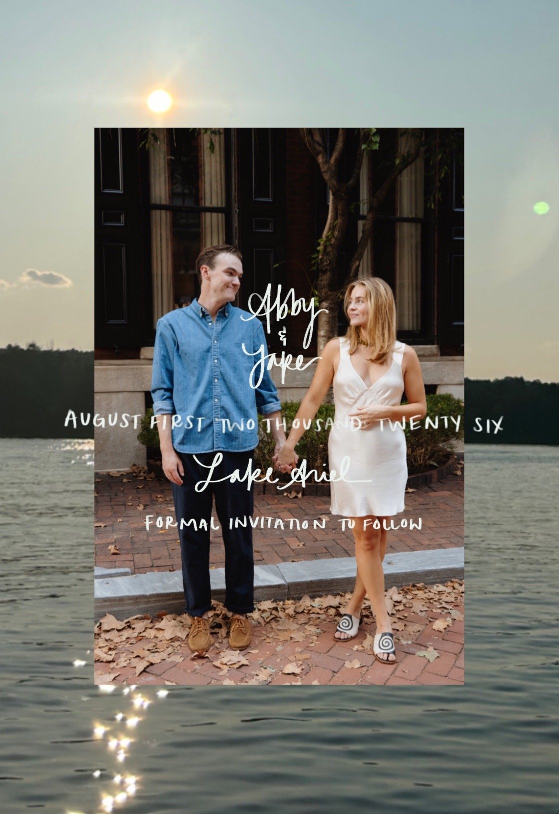 A wedding invitation featuring a photo of a couple holding hands, with text overlaying the image. The couple is standing outdoors on a brick sidewalk with leaves on the ground, in front of a building with trees and curtains in the background. The gro