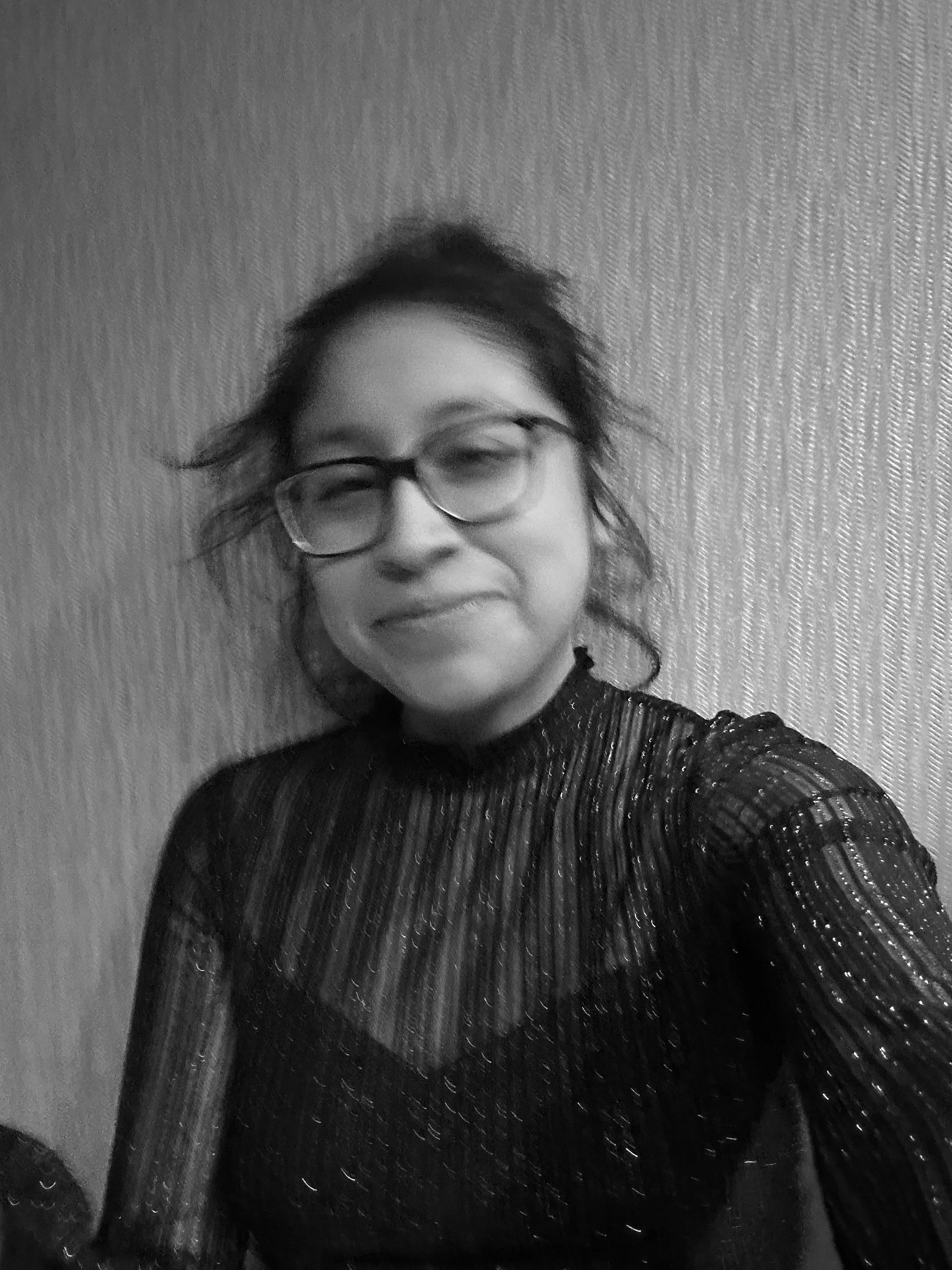 Black-and-white selfie of Iridian Castillo smiling