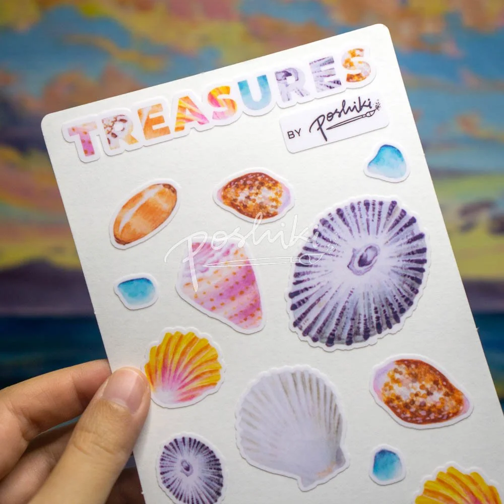A close-up of a watercolor seashell sticker sheet.