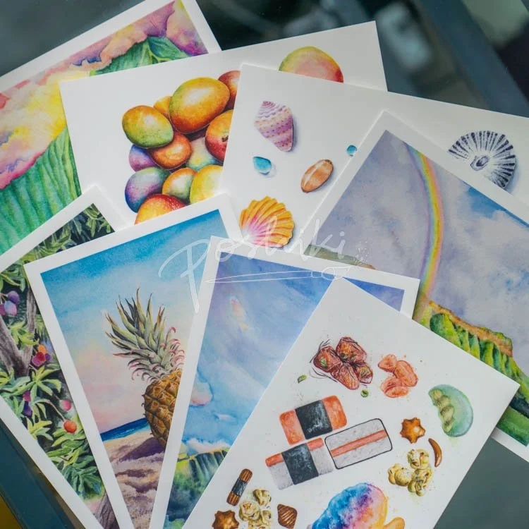 Eight assorted postcards featuring watercolor paintings of Hawaii landscapes, shells and food.