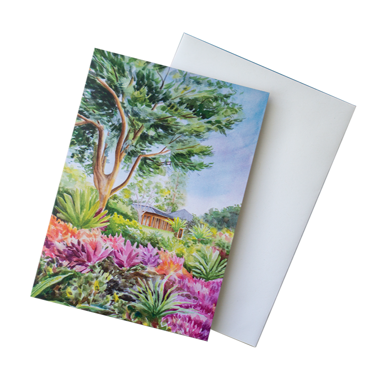 A greeting card featuring a watercolor painting of a lush tropical garden inspired by Sensei Lanai.