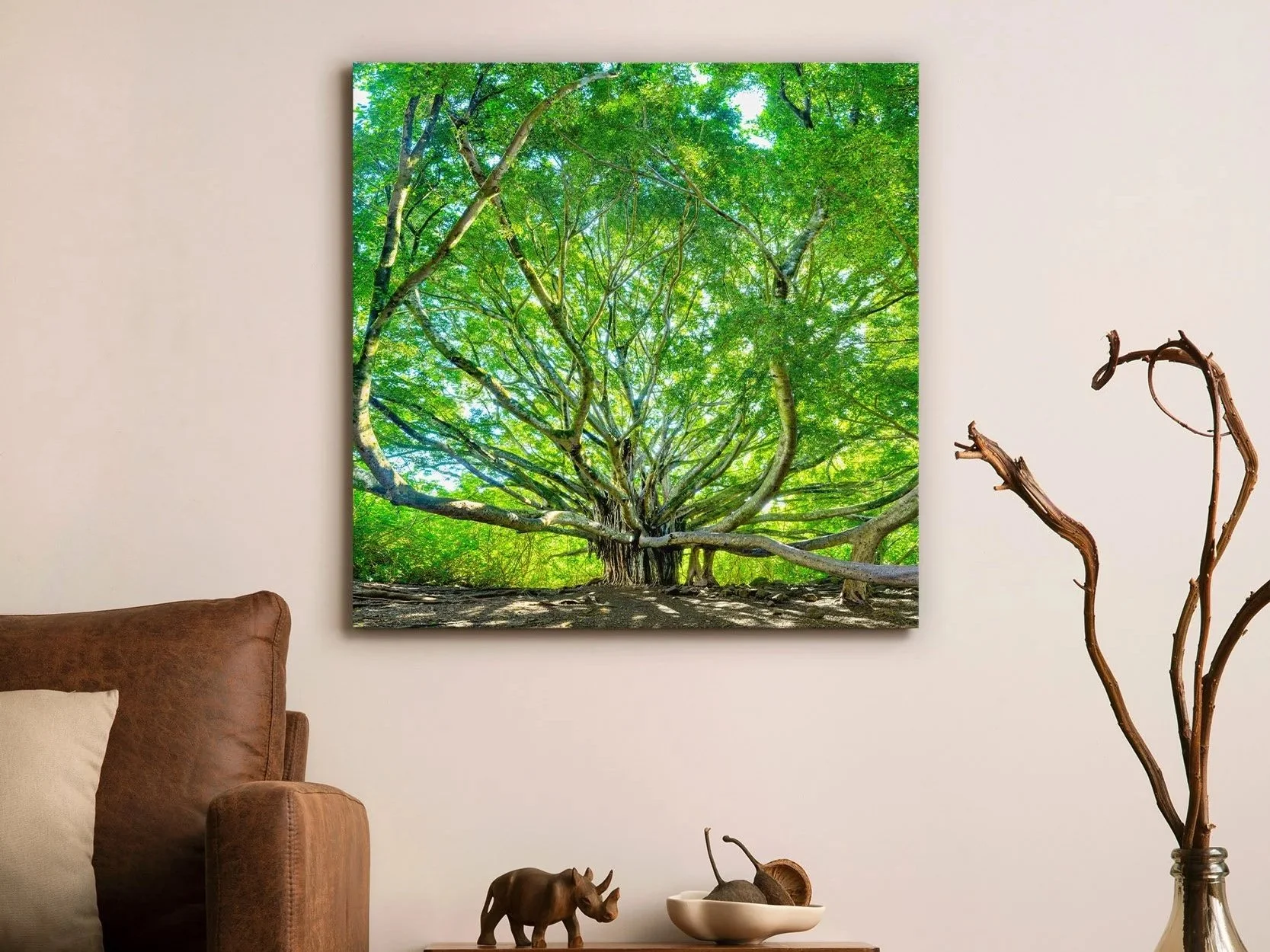 Large-scale Maui banyan tree fine art photography print by Cody Roberts displayed above console table in modern luxury living room