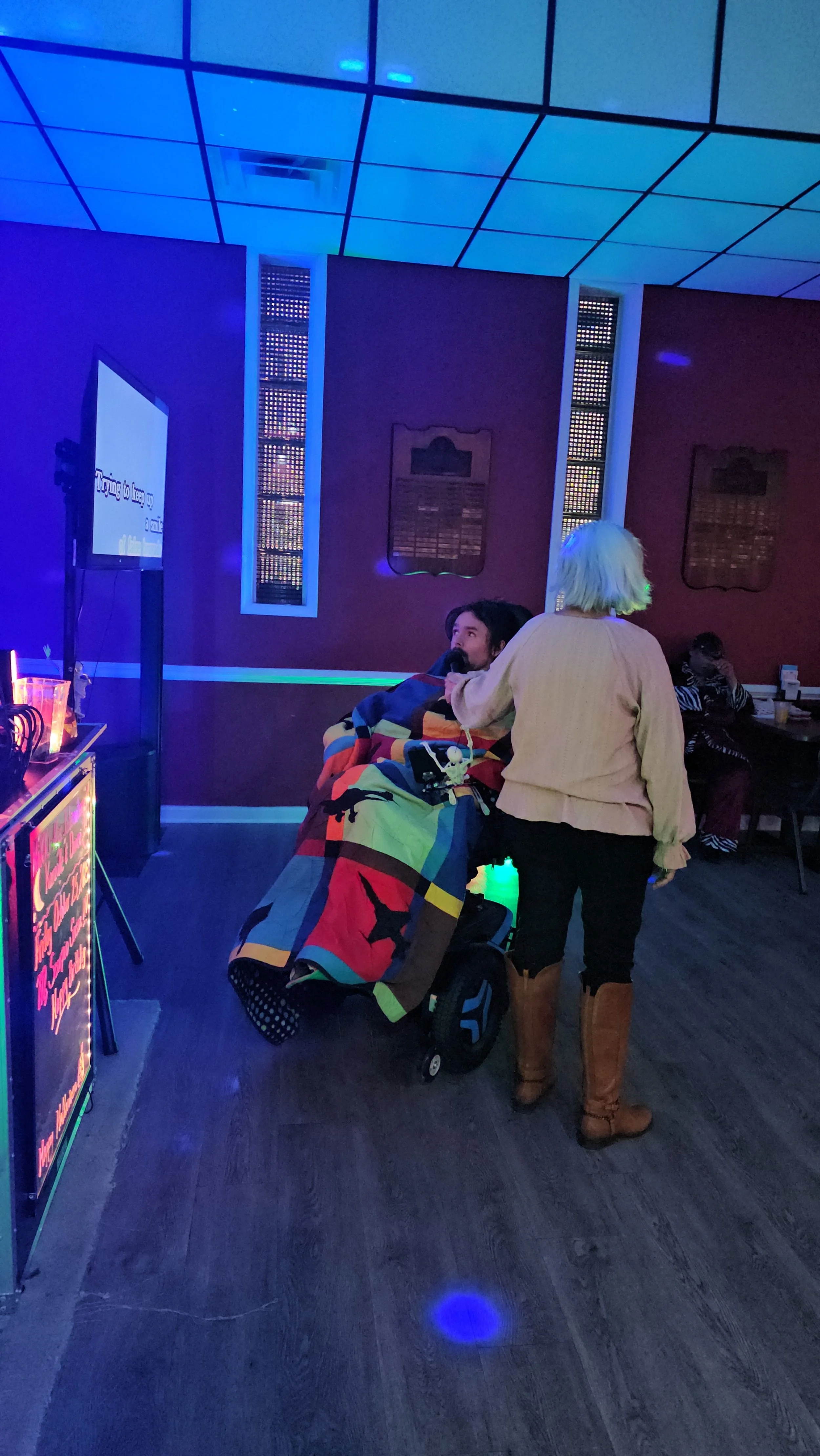 Guests connecting during a Nikki NYX International Karaoke & Dance event, capturing the intimate, inclusive atmosphere where every voice is respected and encouraged.