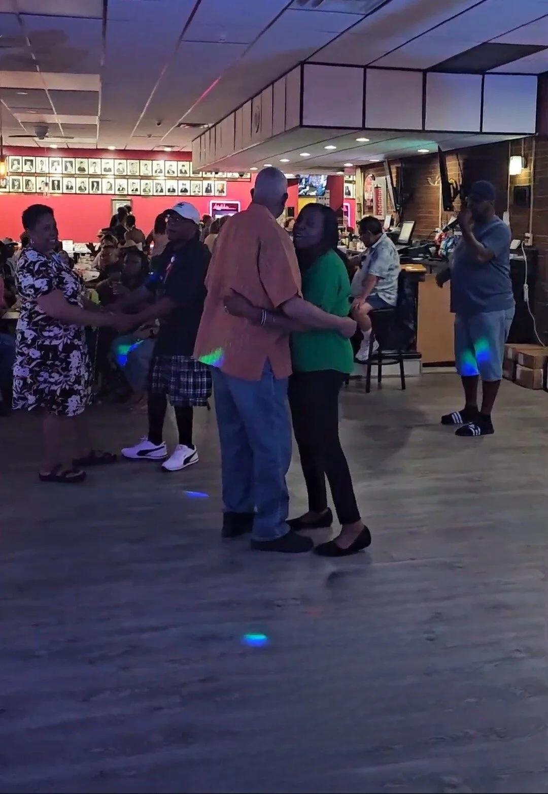 Guests socializing during a Nikki NYX International Karaoke & Dance night, reflecting the relaxed, mature, and inclusive environment beyond traditional bar karaoke.