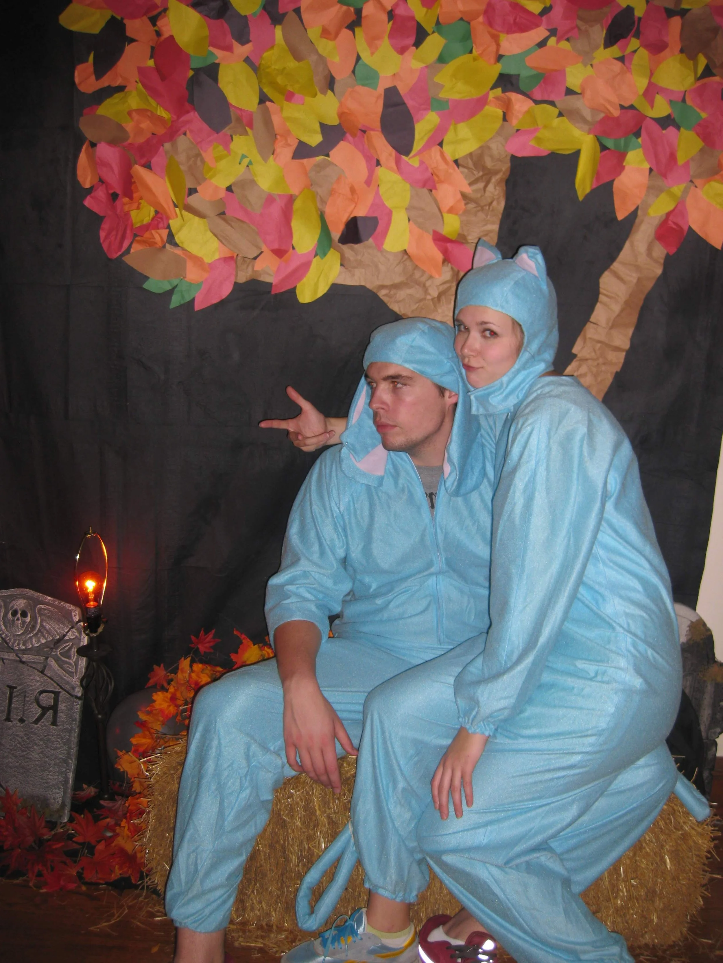 Shuttermutt Photo owners and pet photographers Laura and Adam Claus dressed in blue dog and cat costumes on Halloween