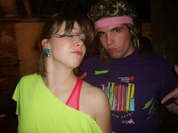 Adam & Laura Claus dressed in 1980s costumes Los Angeles