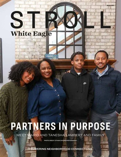 A group of four people standing in front of a brick wall with a window and a mirror. They are smiling and wearing casual clothing. The image features the text 'STROLL' at the top, with 'White Eagle' and 'PARTNERS IN PURPOSE' below, and a caption about meeting Mario and Tanesha Lambert and family.