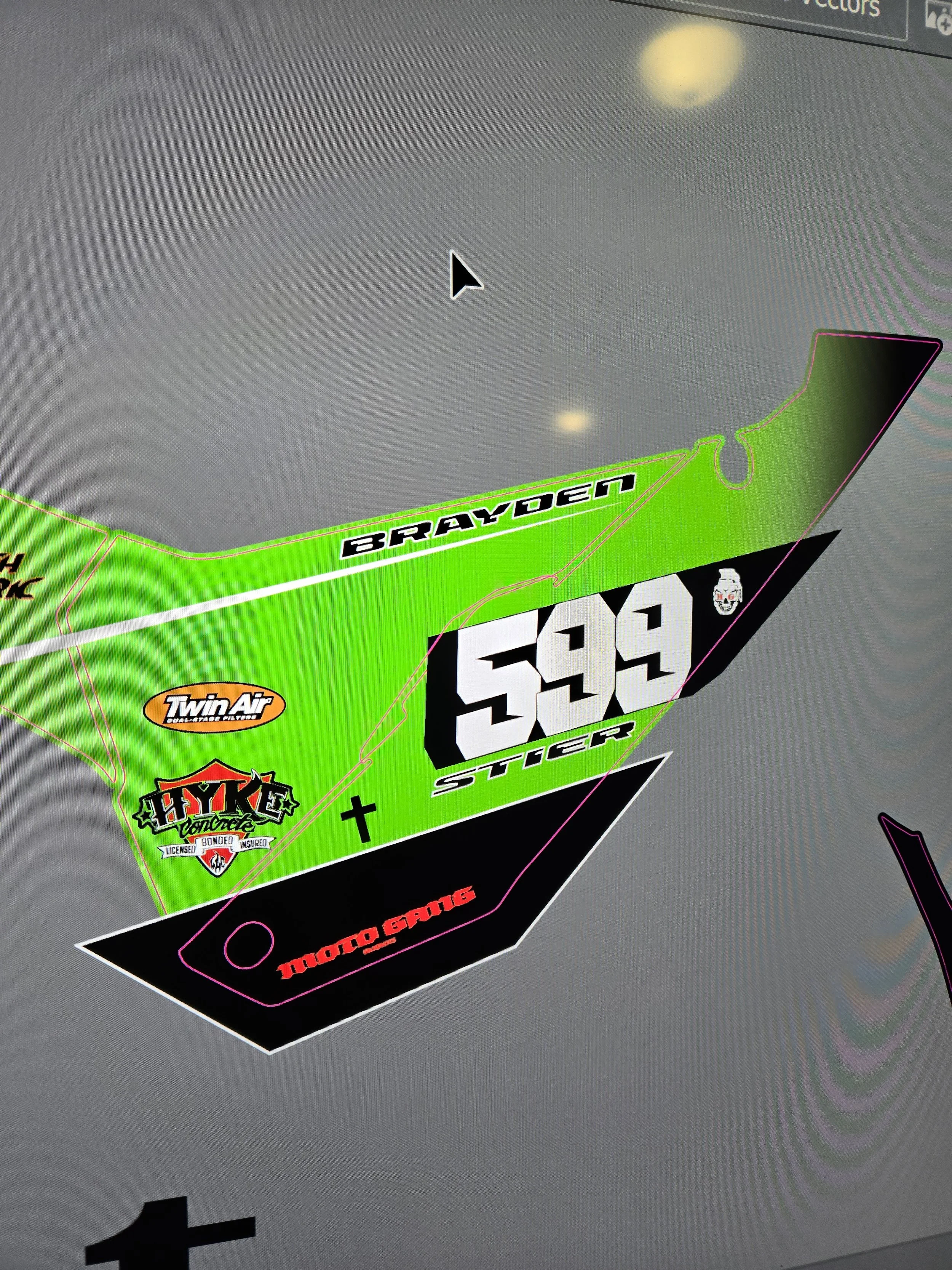 Digital design of a racing helmet with several sponsor logos, including Twin Air, Hayes, and a skull, the name 'Brayden,' the number 599, and other graphics.
