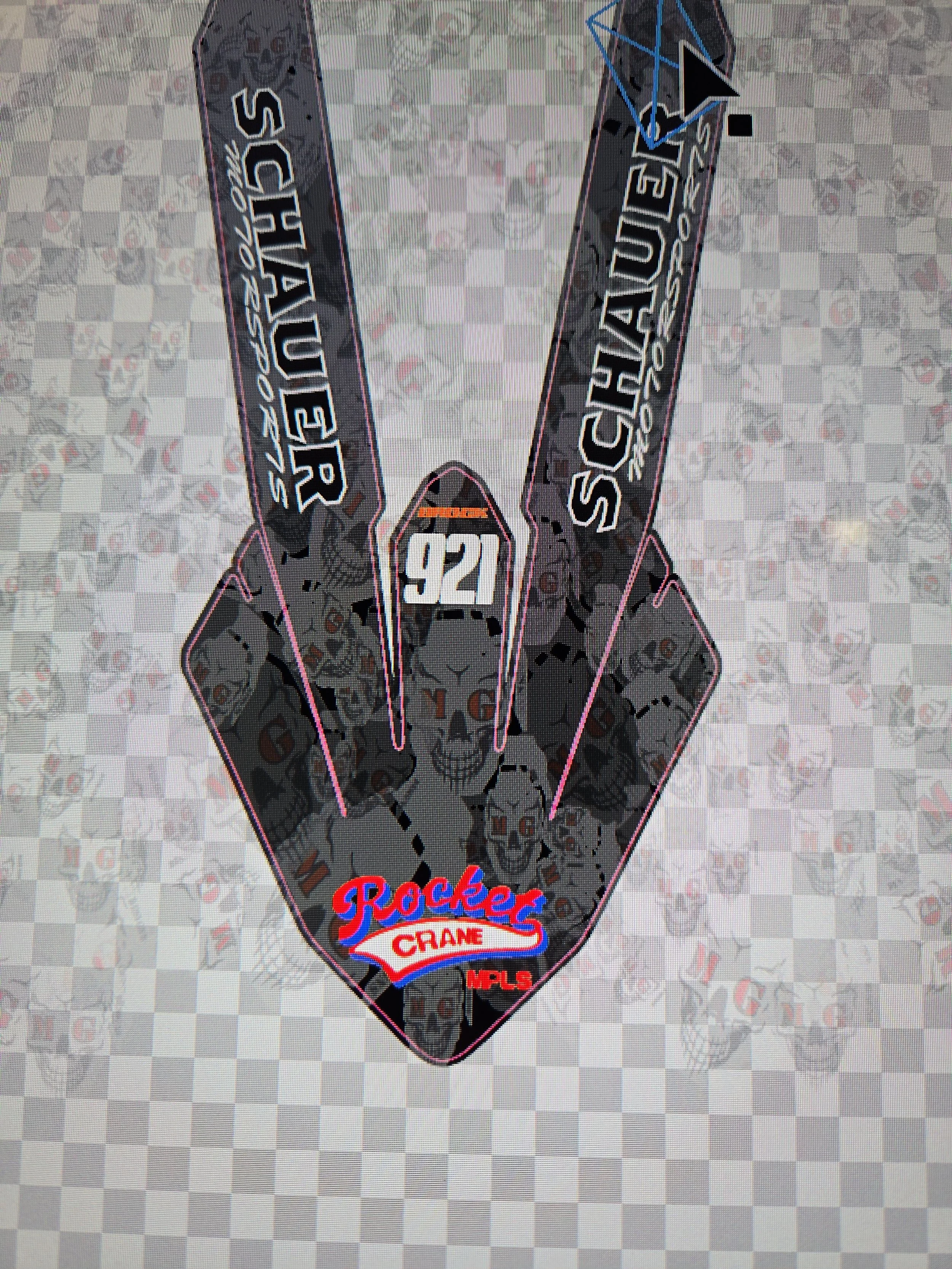A decal or sticker with a stylized rocketship design, featuring the text 'Rockets Crane' and the number '921'. It also includes phrases like 'Sugar', and 'MPLS', with a background of skulls and dark graphics.