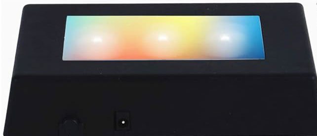 A black electronic device with a colorful rectangular display on top and a small control knob on the front.