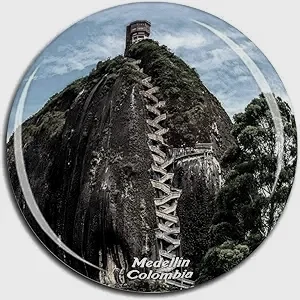 A tall mountain with stairs leading to a lighthouse at the top, in Medellín, Colombia.