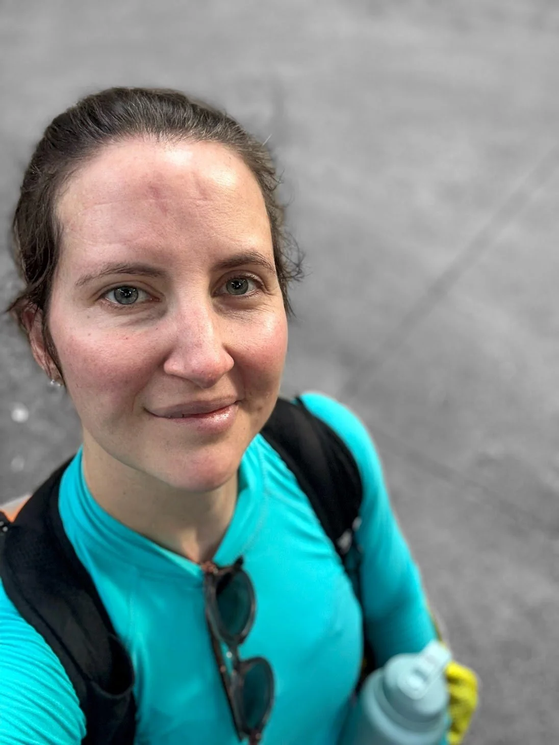 Female swim instructor happily preparing for swim lesson with adaptive adult student who is scared of the water and wants to learn to be comfortable while swimming.