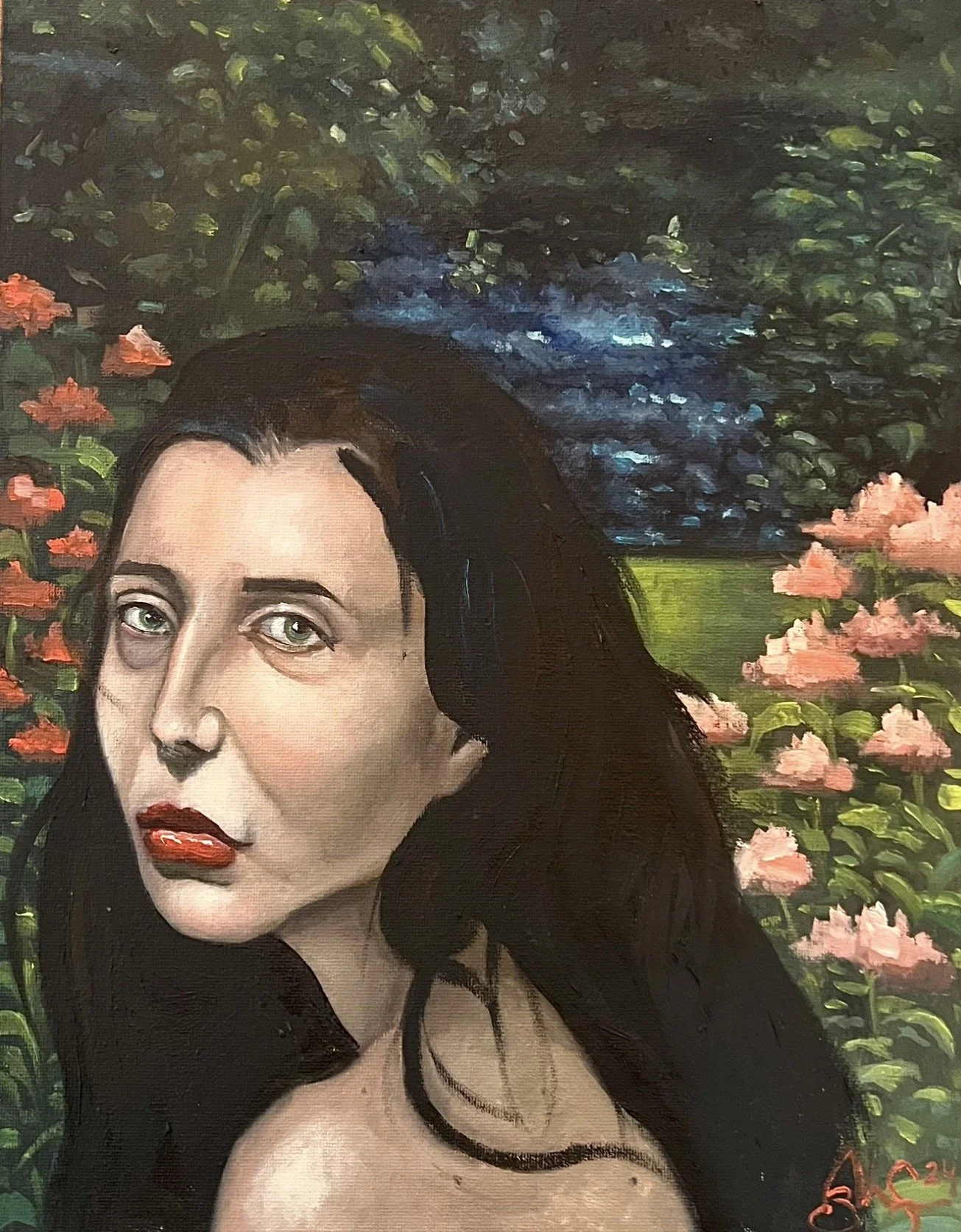 Close-up of a woman with pale skin and dark hair, surrounded by pink flowers and greenery under a blue sky with trees.