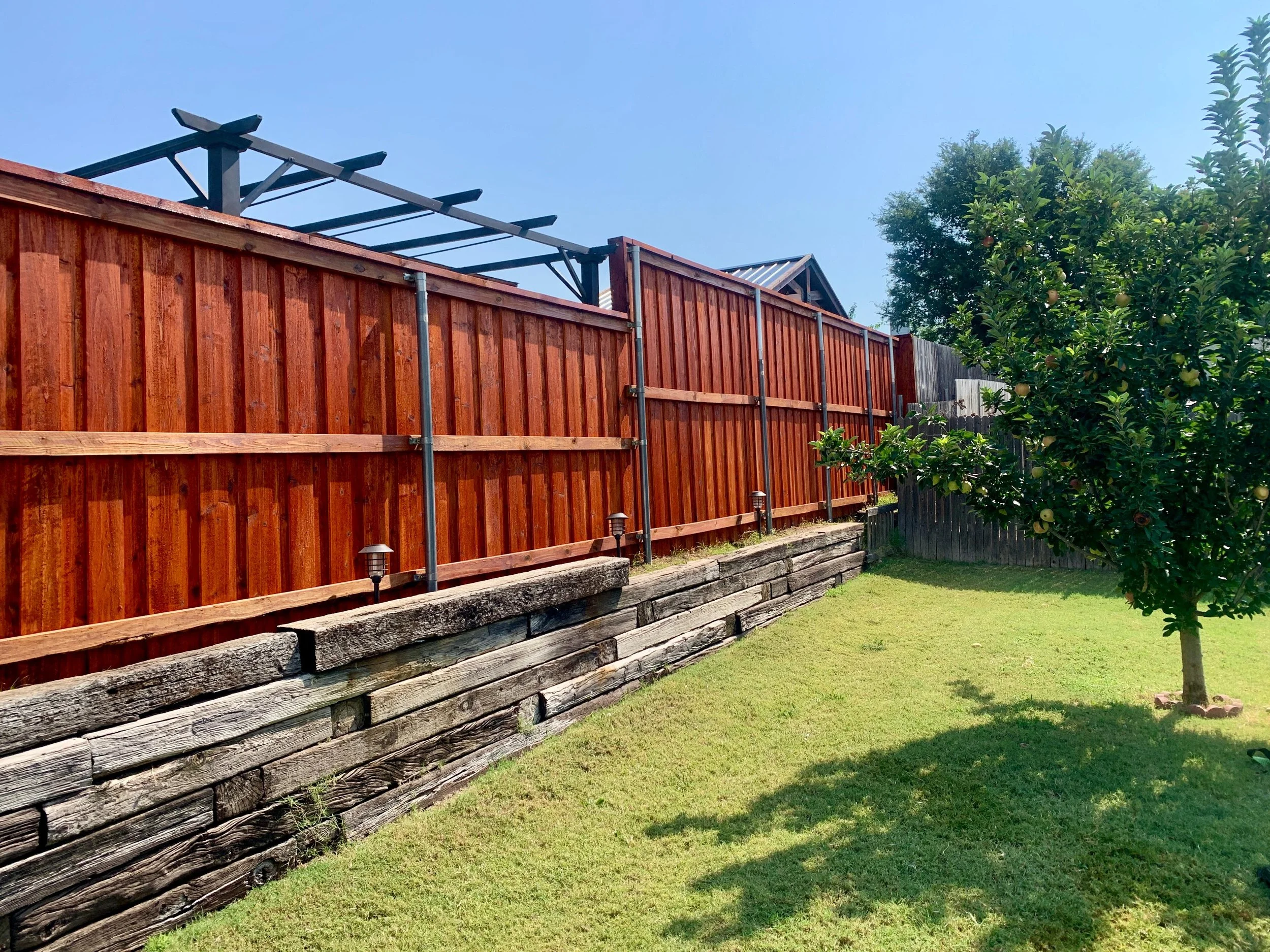 Wooden privacy fence installed by SD PROJECTS LLC.