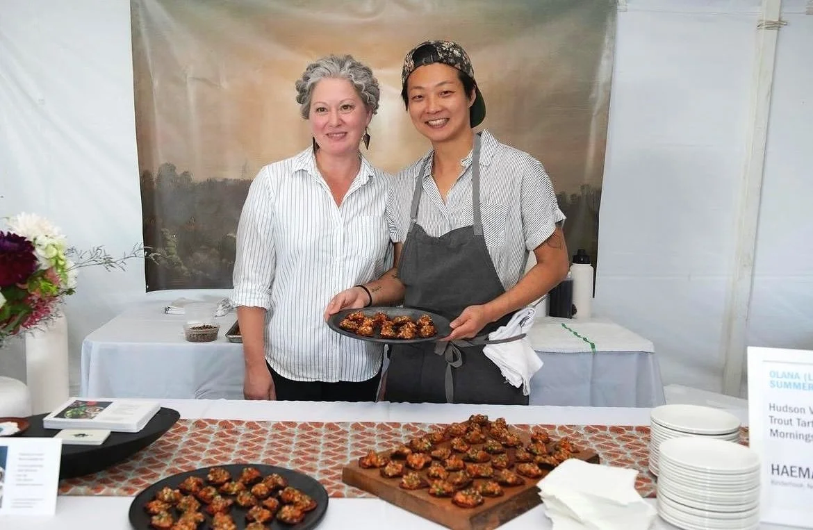 Hannah Wong and SJ showcasing food at a Hudson Valley pop-up dinner.