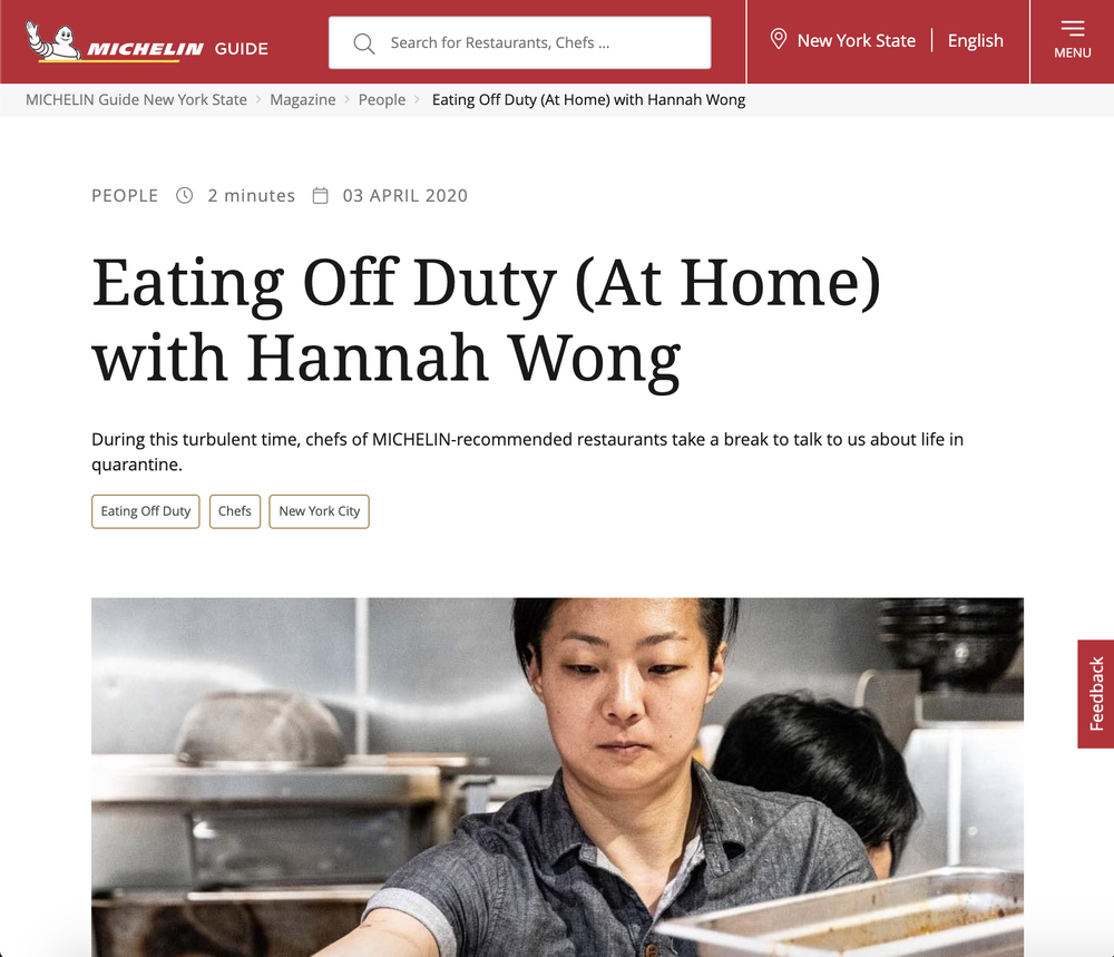A woman in a gray shirt working in a kitchen with stainless steel appliances and utensils. Michelin Guide article featuring Hannah Wong of Haema Hospitality.