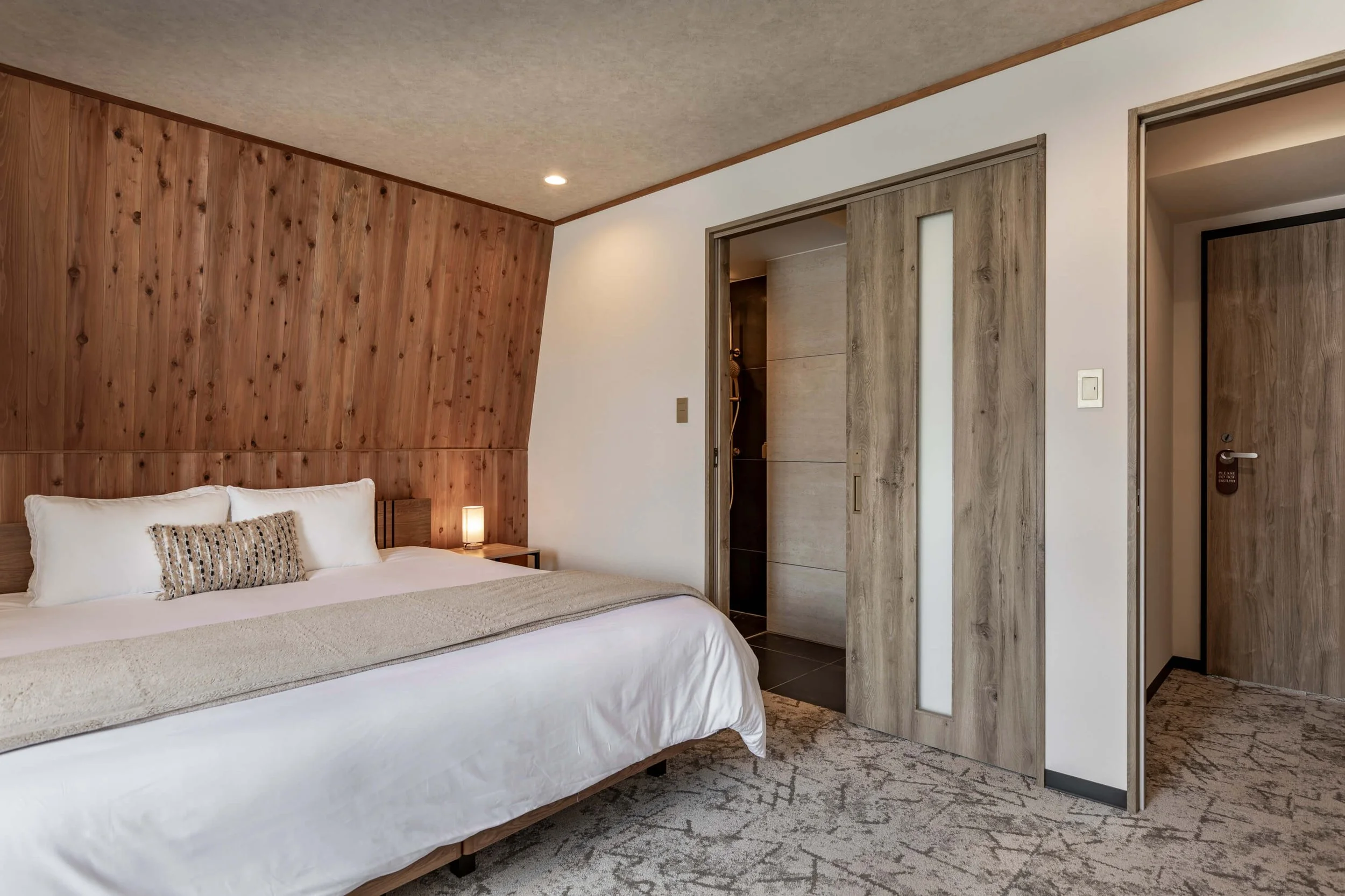 King room at The Residence Myoko with premium bedding, ensuite, and mountain views.