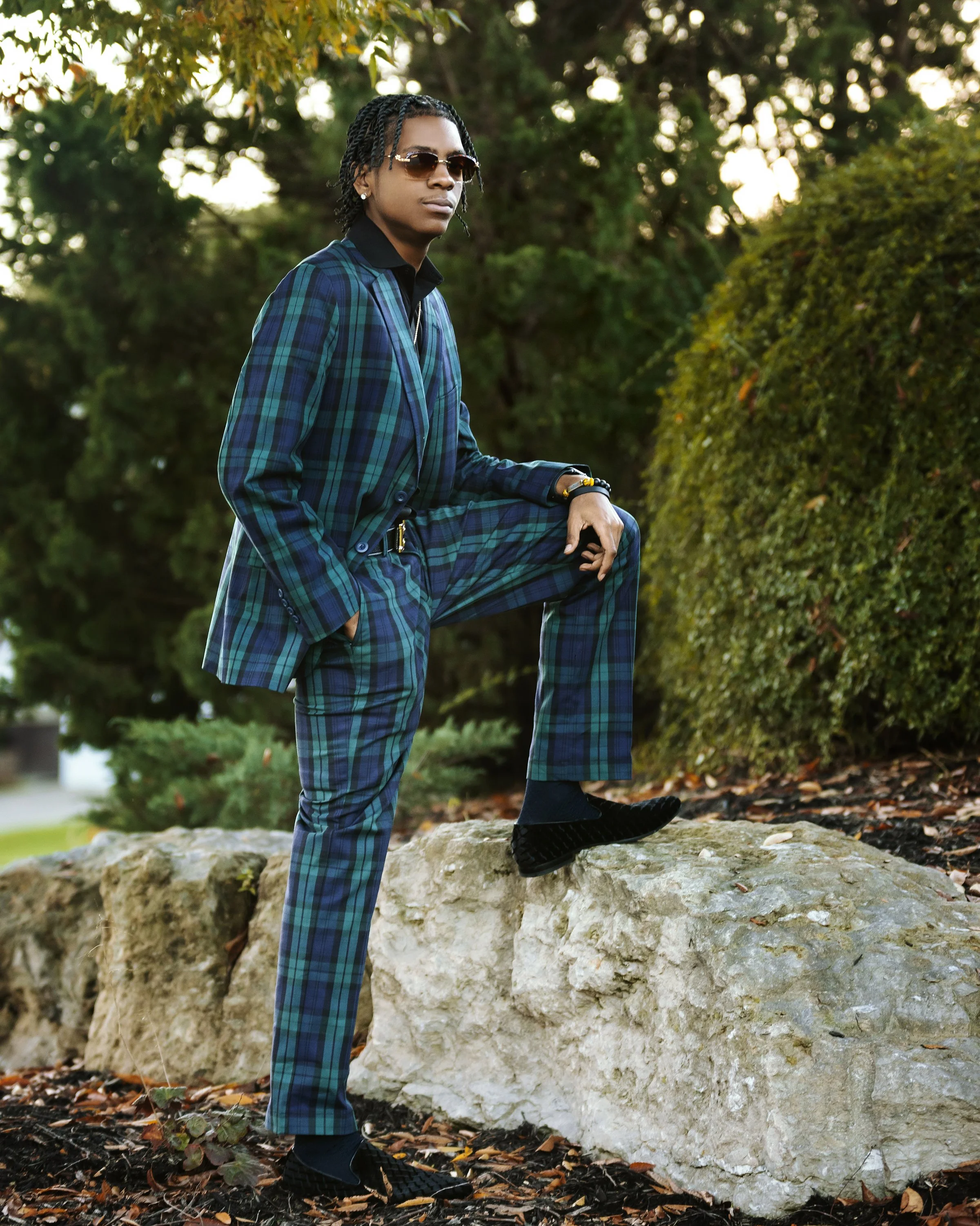2609senior-boy-plaid-suit-photoshoot-louisville-ky-rock-pose8x10.jpg