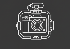 Line drawing of a camera with a surrounding ring and attached accessories on a dark background.