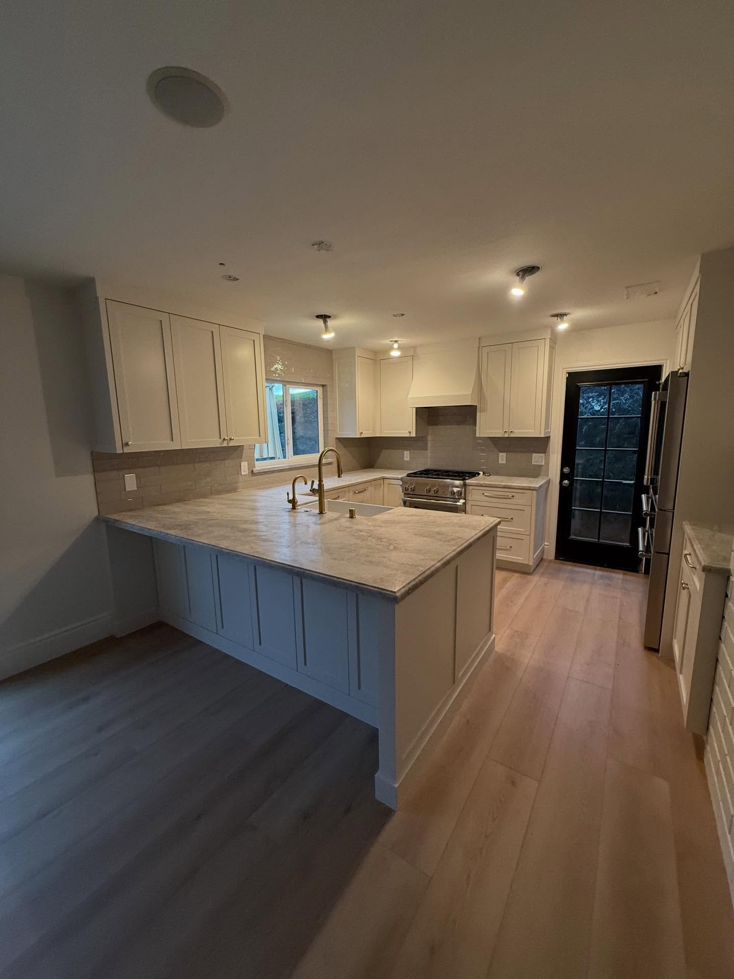 This kitchen is all about the details 🤍
From fully custom spray-finished cabinets to a classic farmhouse sink, Taj Mahal slab countertops with elegant ogee bullnose edges, and integrated custom appliances&mdash;every inch was designed for beauty and