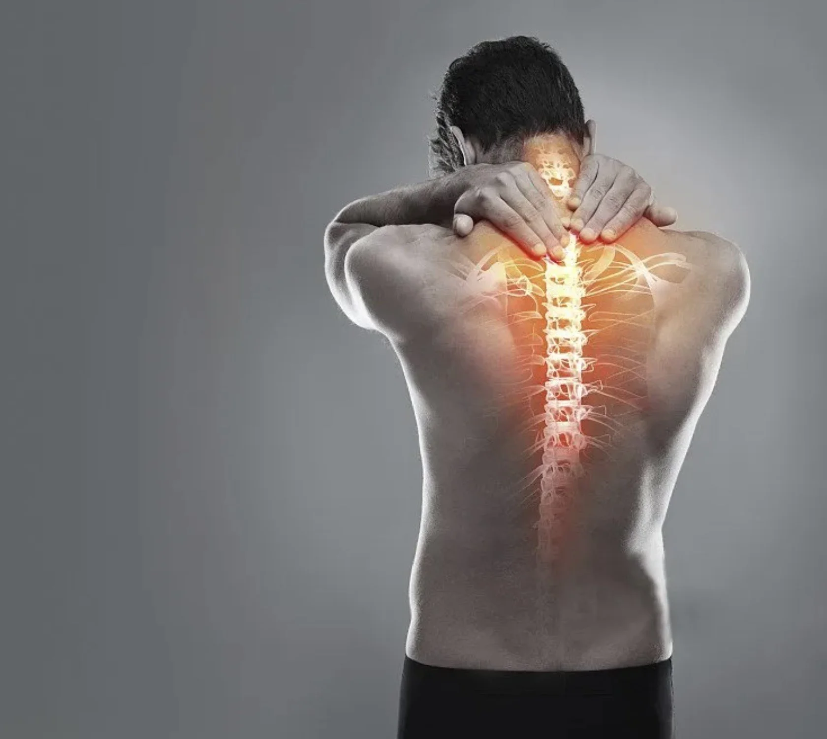 A person with their back to the camera, holding their shoulder, with a graphic overlay of the spine and nerves in the neck and upper back area highlighted in orange, indicating pain or inflammation.