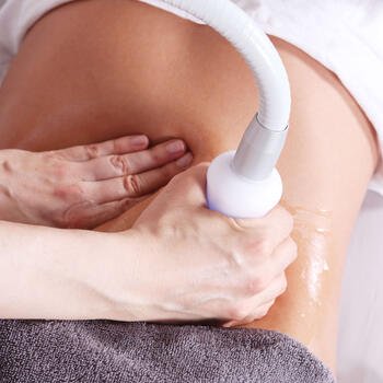 Person receiving an ultrasound medical exam on their abdomen.