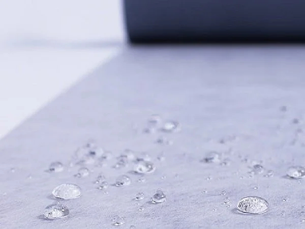 Waterproofing, showing droplets of water not penetrating the membrane