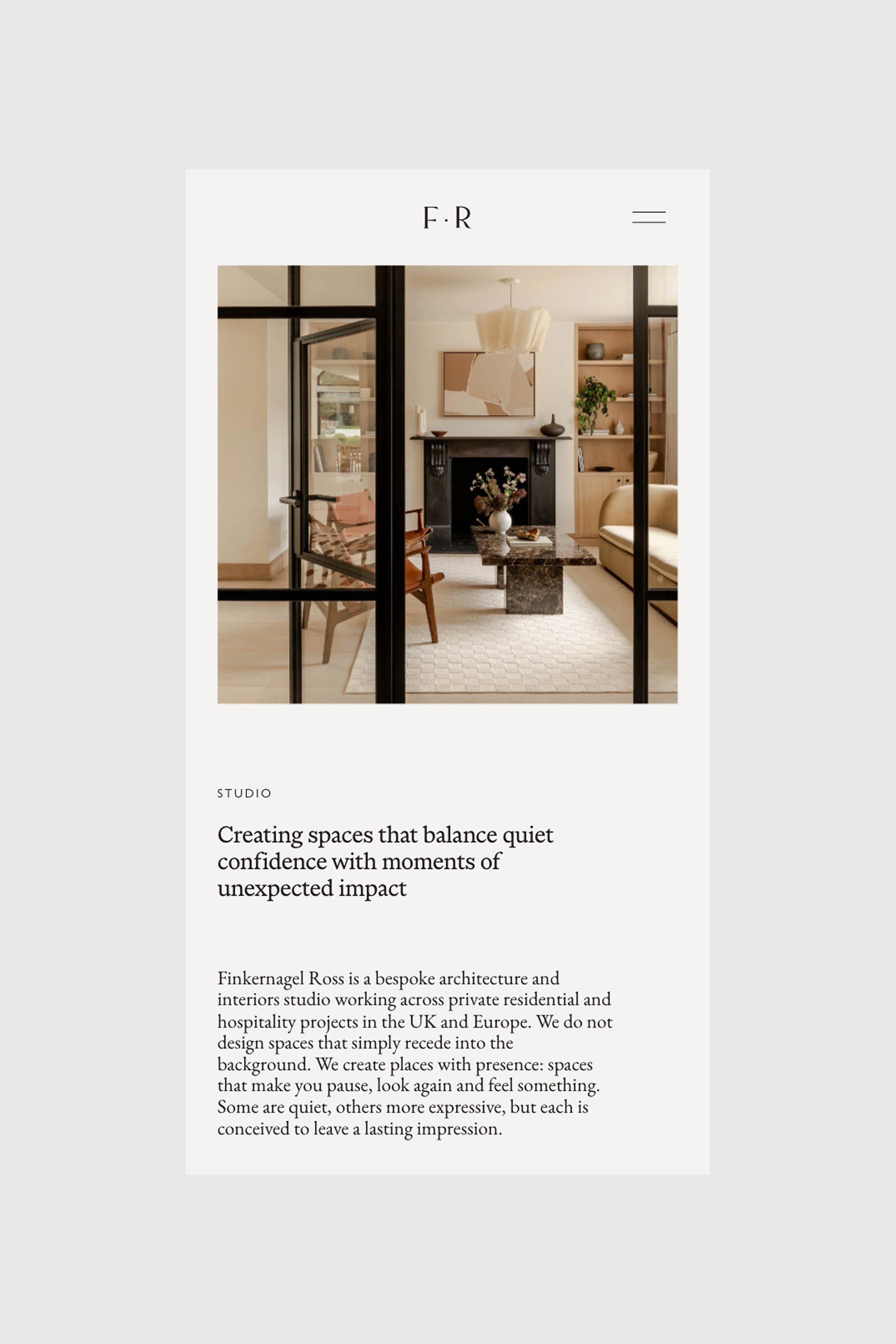 A screenshot of a website featuring a home interior image with a fireplace, a beige sofa, a pergola with black metal framing, and a walking space in an open living area.