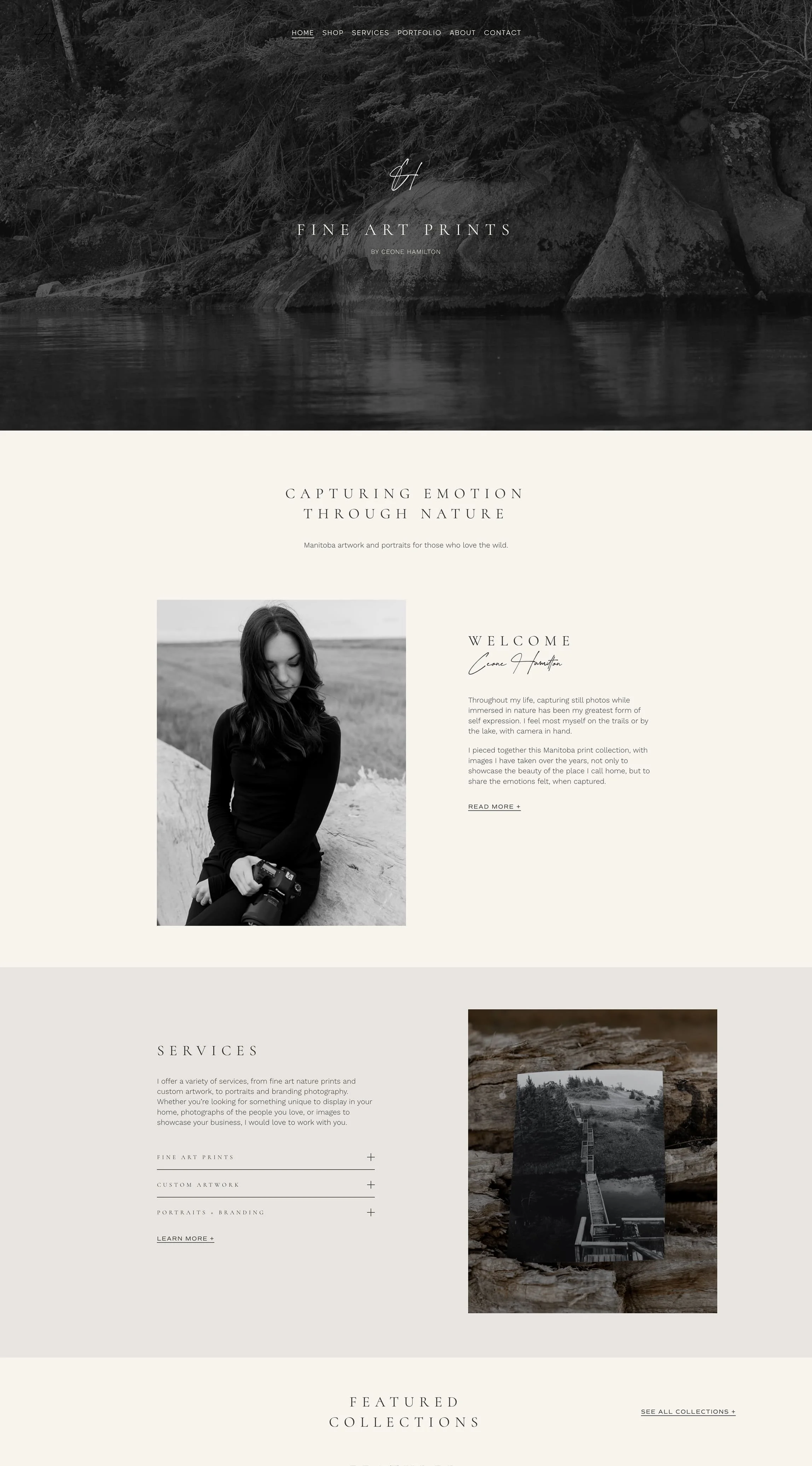 A grayscale photograph of a woman sitting outdoors. She has long dark hair, wears a black long-sleeve shirt, and holds a camera. She is sitting on a rock with a natural landscape in the background.