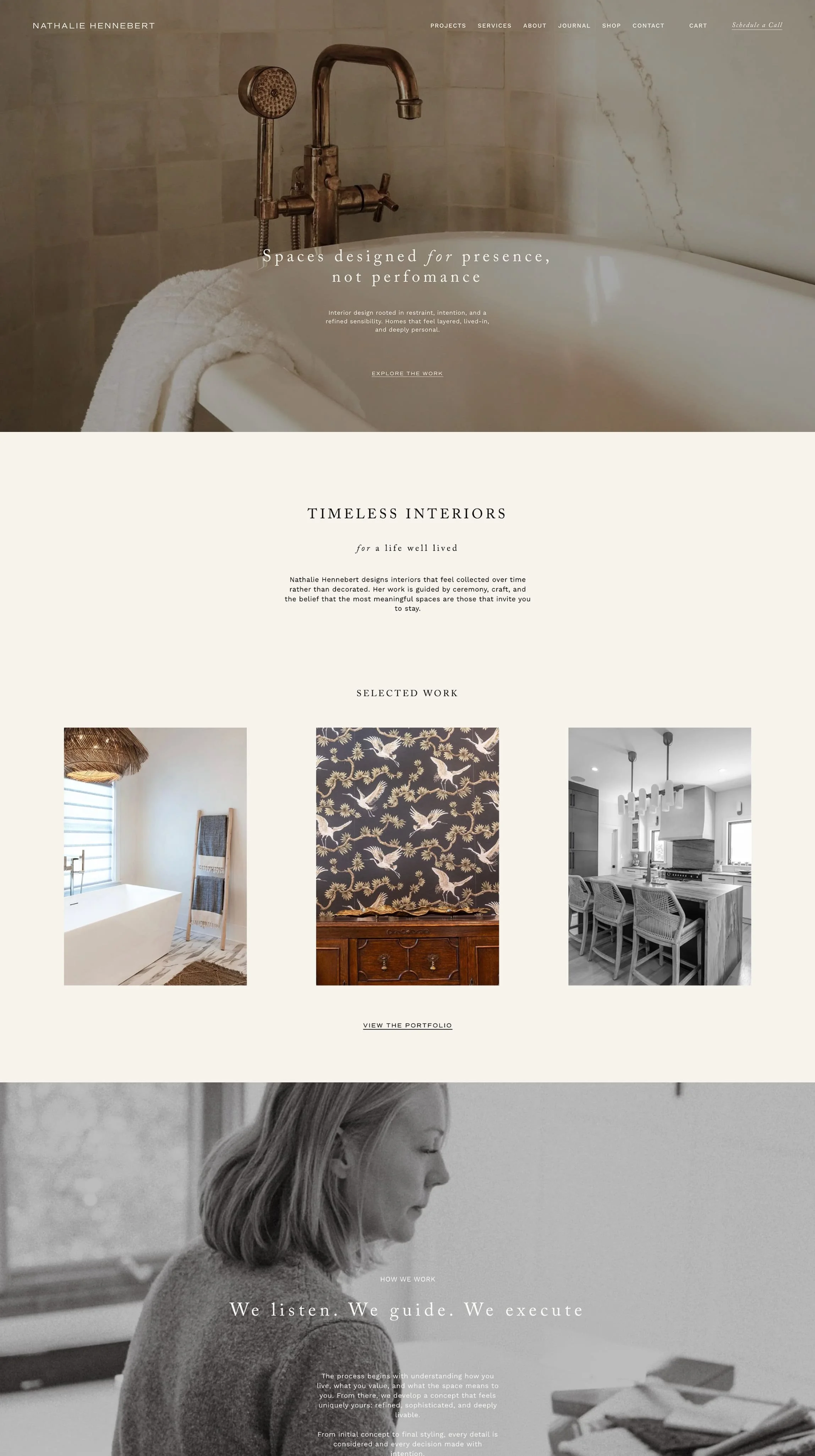 A website homepage for Nathalie Hennebert, featuring interior design projects. The top image shows a vintage-style bathroom faucet with a bathtub and a white towel. Below, there are three sections showing interior spaces: a bathroom with a bathtub and window, a wall with white cranes and botanical patterns, and a modern kitchen with a breakfast bar and pendant lights. The bottom section has black-and-white photo of a woman working at a desk.